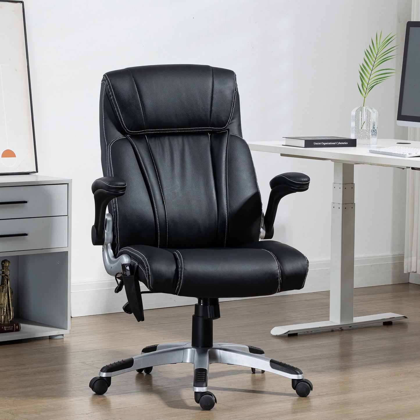 Black executive office chair with padded seat and armrests ideal for comfortable work
