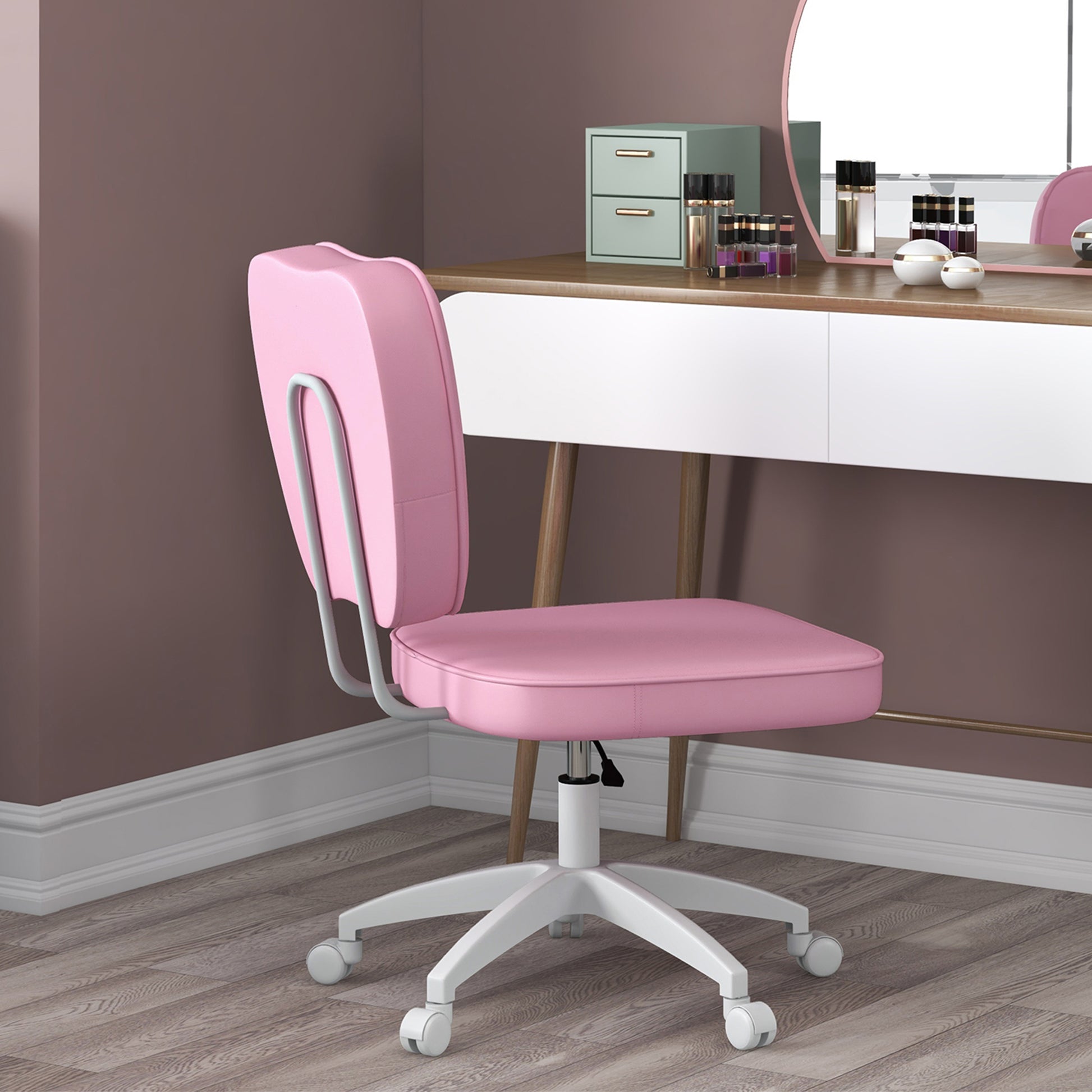 Pink ergonomic desk chair with white base and wheels for a home office