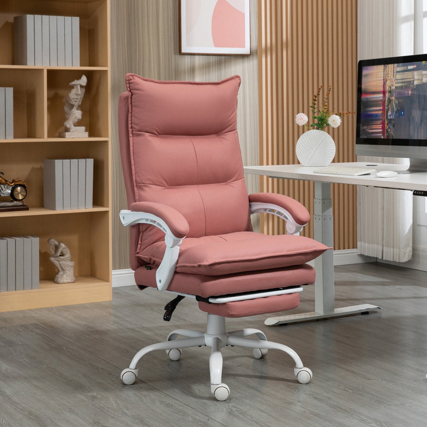 Plush pink ergonomic office chair with adjustable footrest and white accents