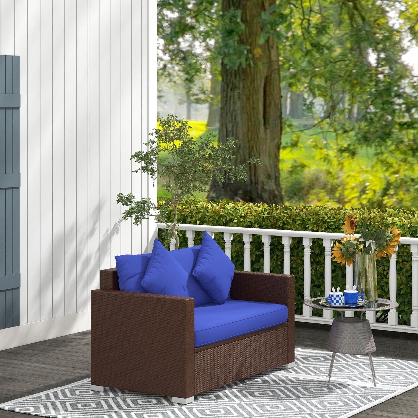 Brown wicker loveseat with bright blue cushions on a deck perfect for outdoor relaxation