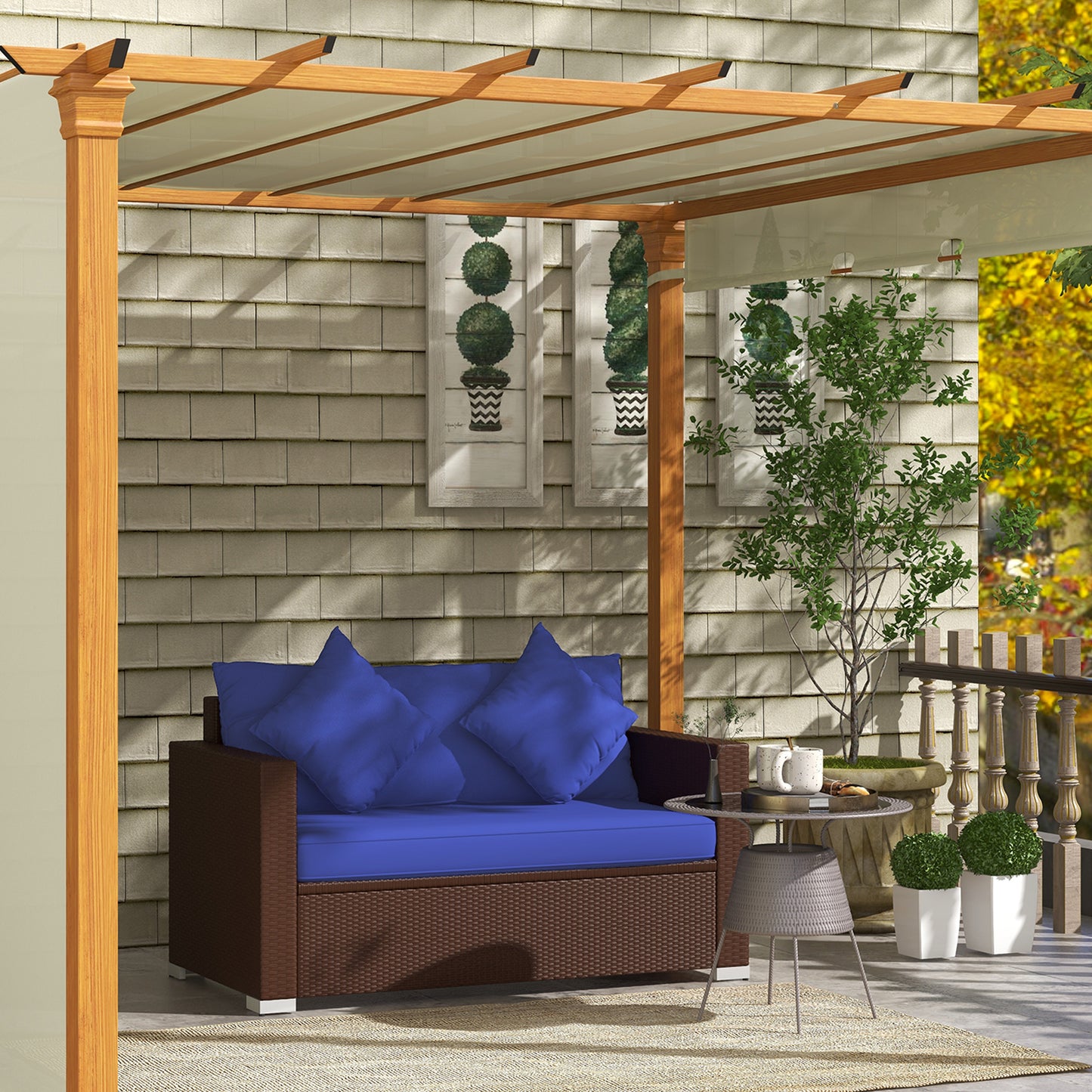 Brown rattan outdoor sofa with plush blue cushions and pillows