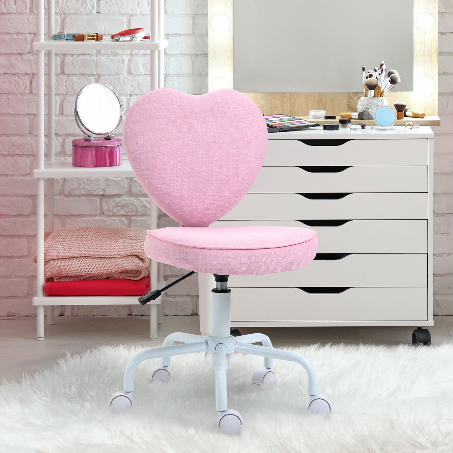 Pink heartshaped office chair with adjustable height and wheels for a childs desk
