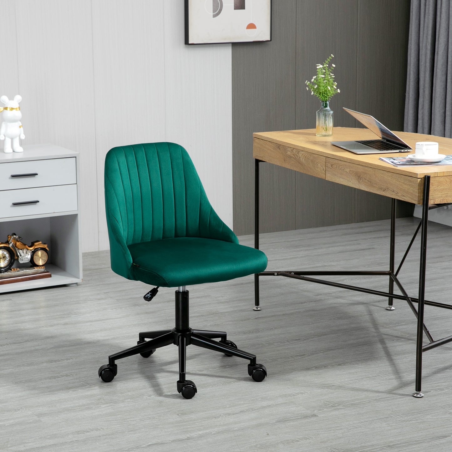 Emerald green velvet office chair with fluted backrest and black base