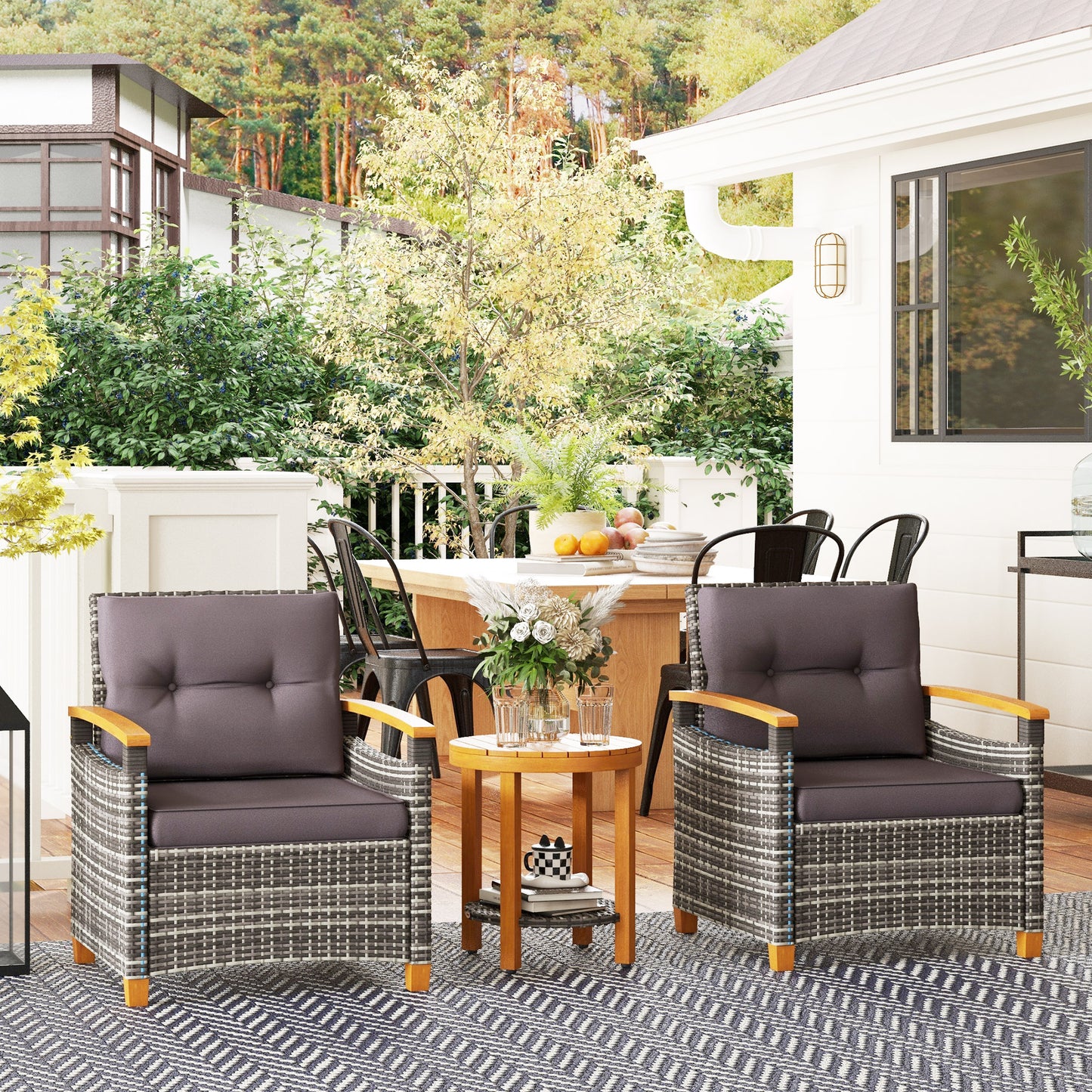 Rattan armchair with plush grey cushions and wooden armrests for outdoor seating