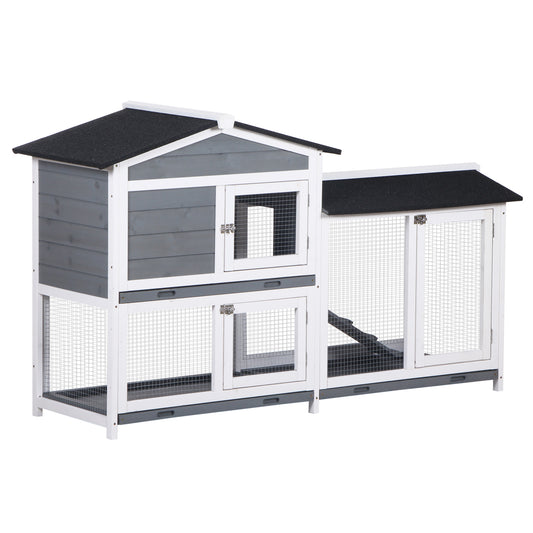 Gray and white twostory outdoor rabbit hutch with mesh doors and wooden siding
