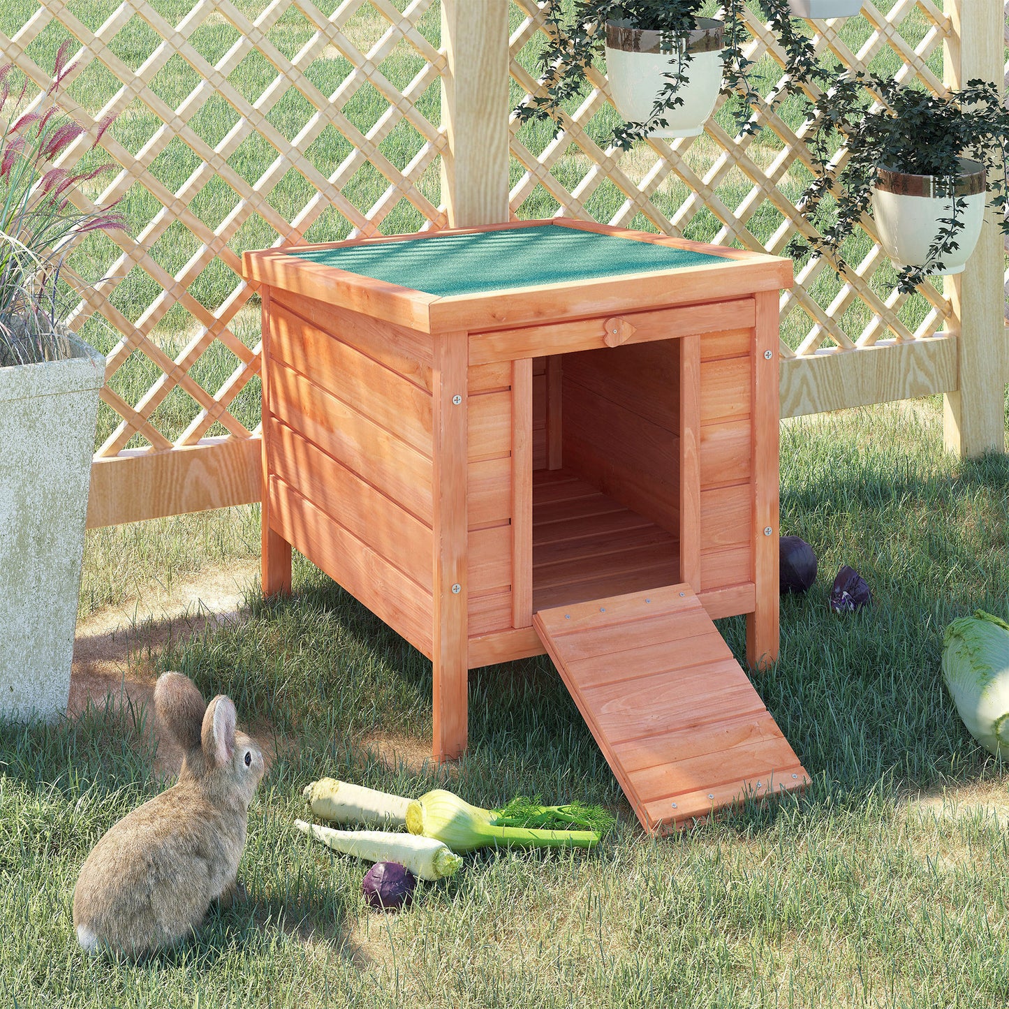 Wooden rabbit hutch with ramp and green roof providing a safe outdoor enclosure
