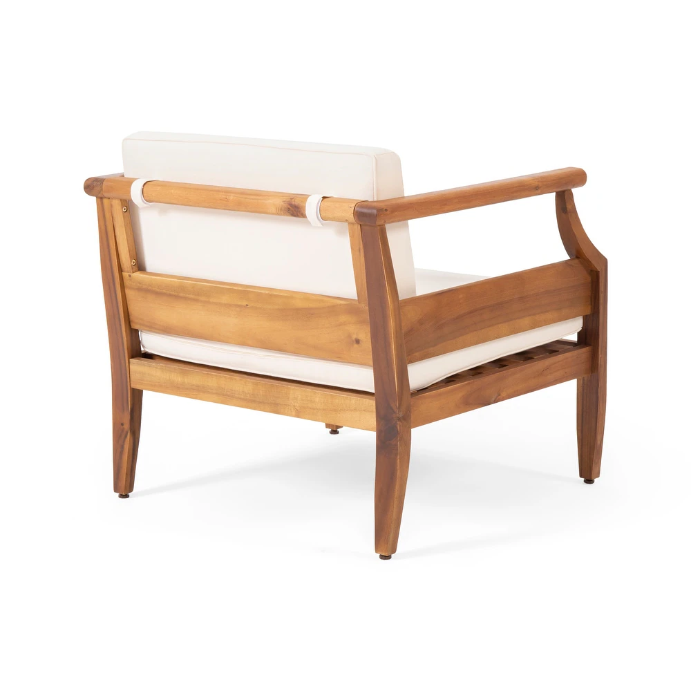 Natural wood armchair with cream cushions ideal for outdoor relaxation