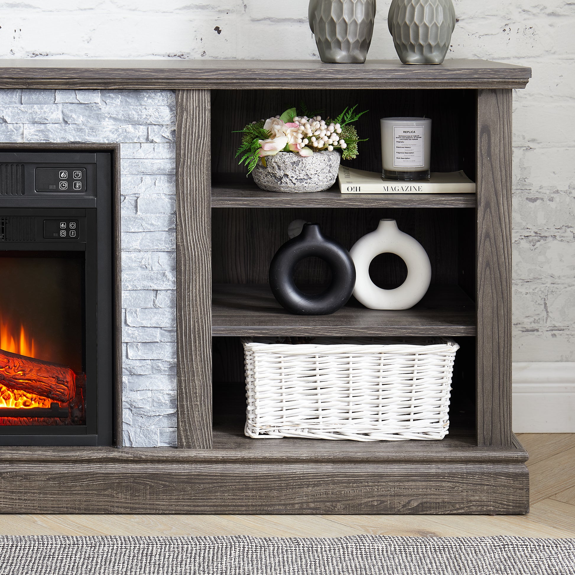 Dark wood electric fireplace with white stone surround and integrated shelving