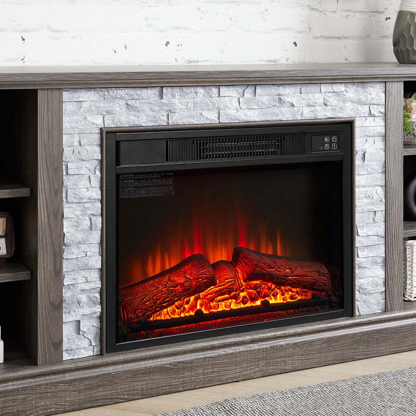 Realistic electric fireplace with glowing logs and stacked stone surround