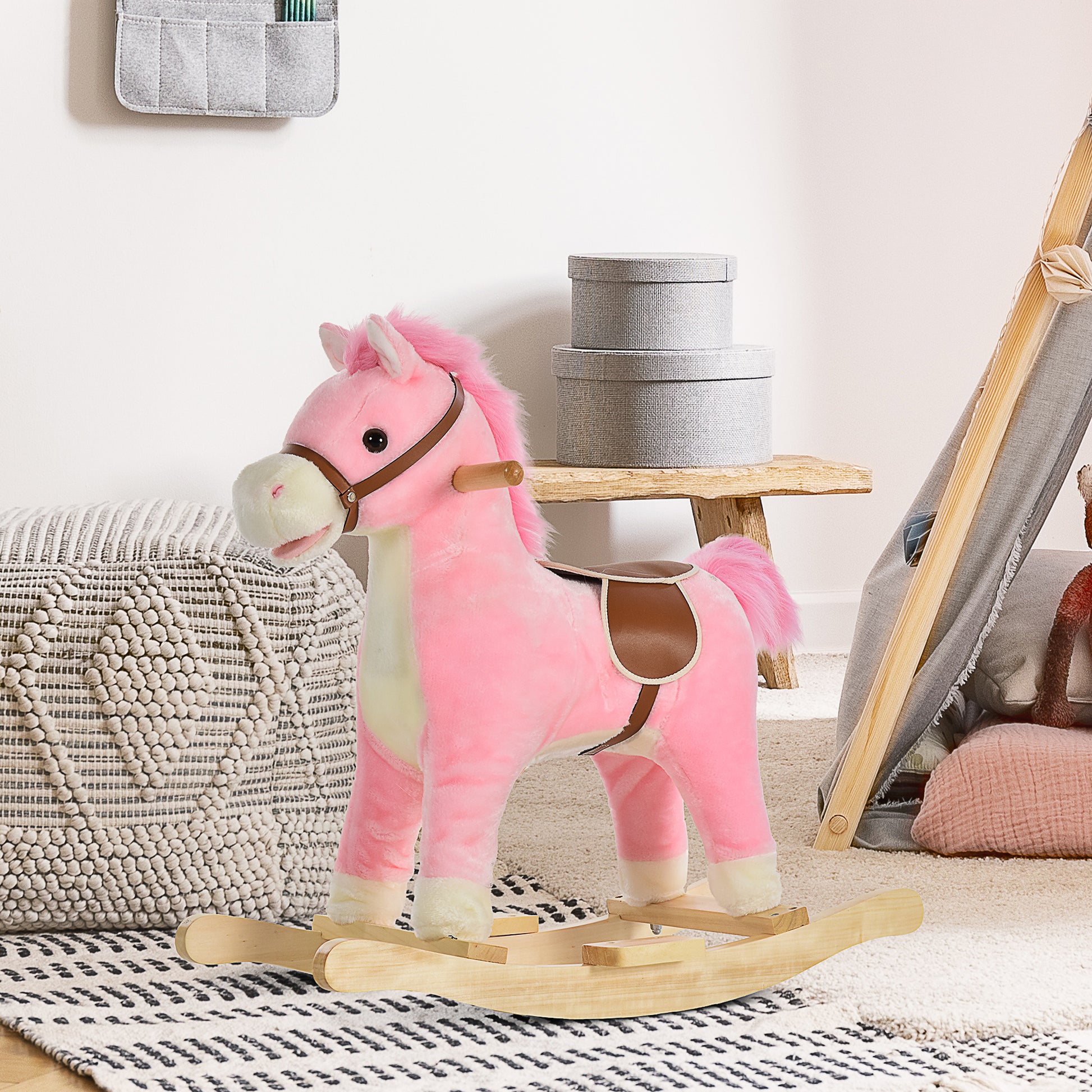 Pink plush rocking horse with faux leather accents and wooden base for toddler fun