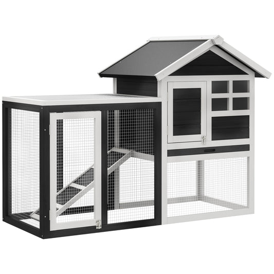 Twotier black and white wooden chicken coop with wire mesh runs and ramp