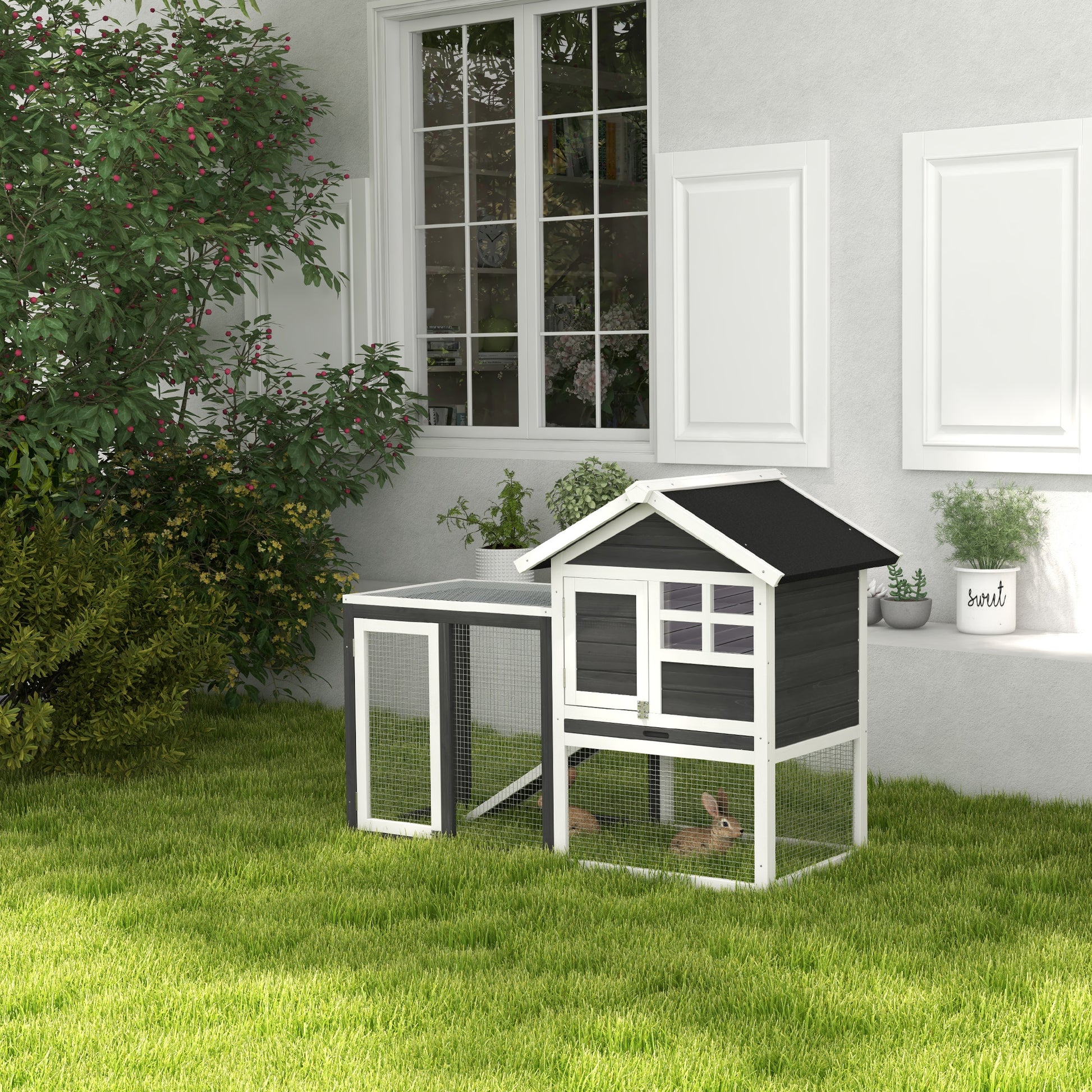 Twotier dark gray and white wooden rabbit hutch with wire mesh sides and two rabbits inside