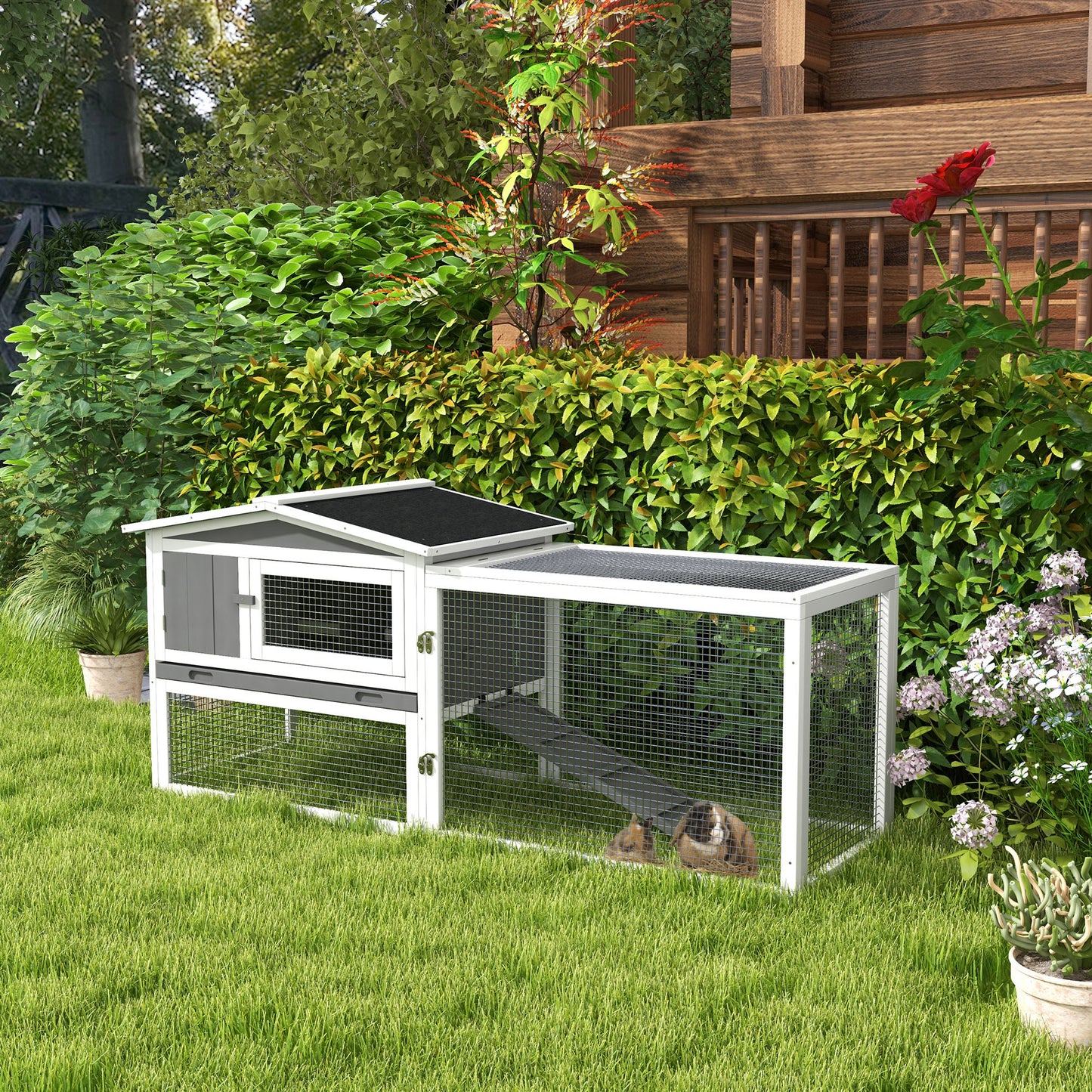 Twotier white and gray outdoor rabbit hutch with ramp providing safe outdoor space
