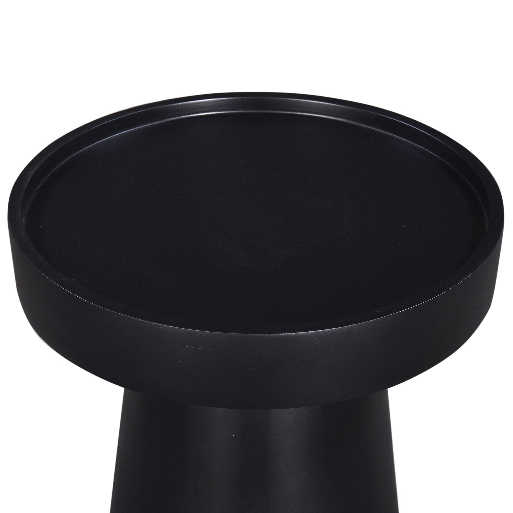 Sleek black accent table with a round minimalist design for modern living spaces