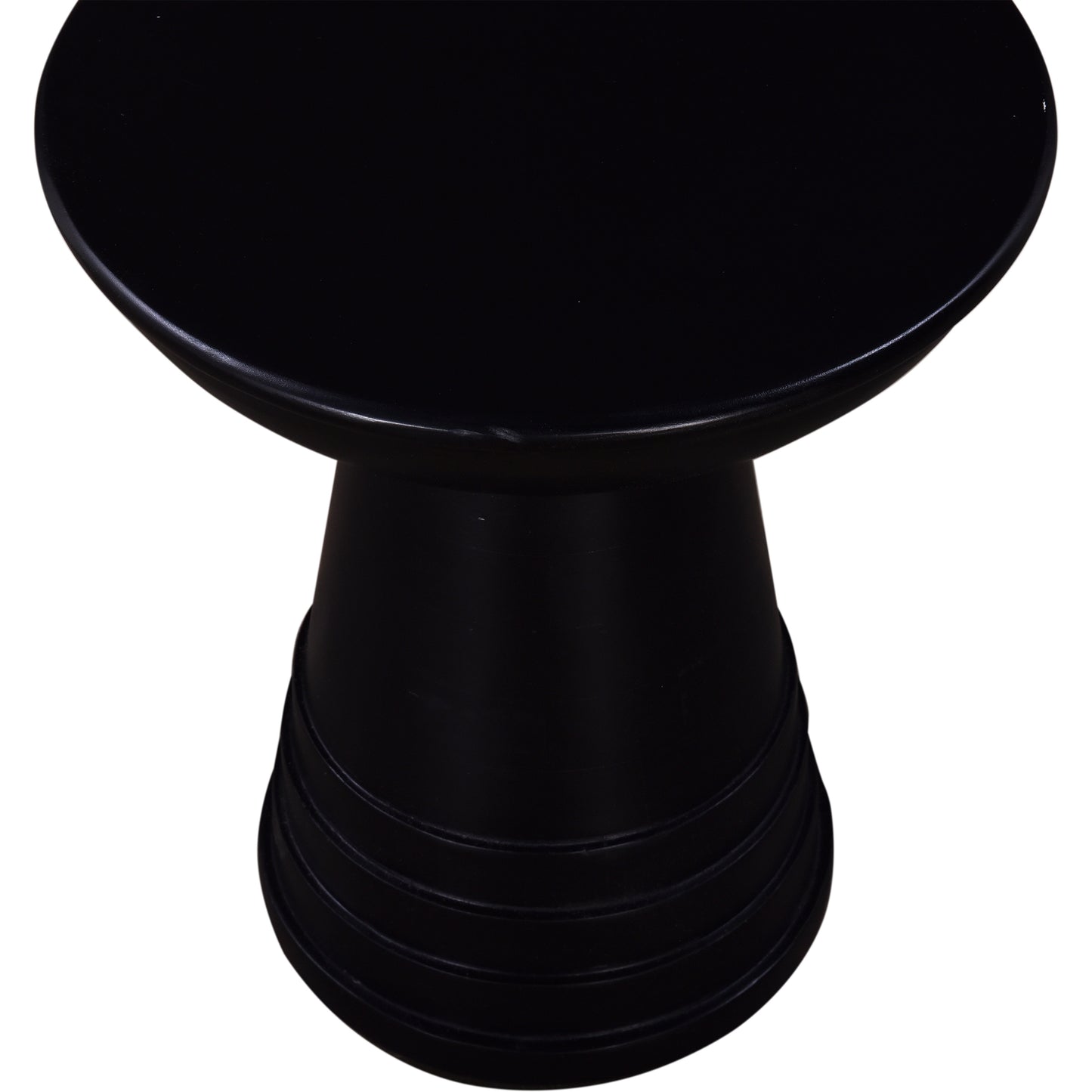 Black modern ceramic stool with a sleek rounded top and a ribbed cylindrical base