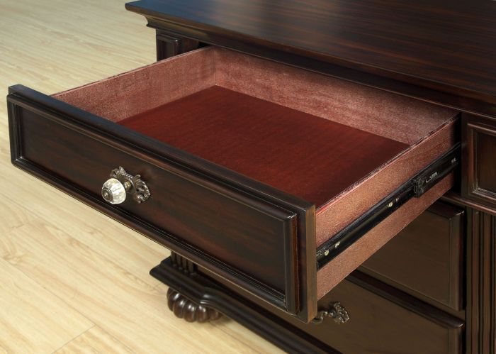 Dark cherry wood dresser drawer with crystal knob and velvet lining