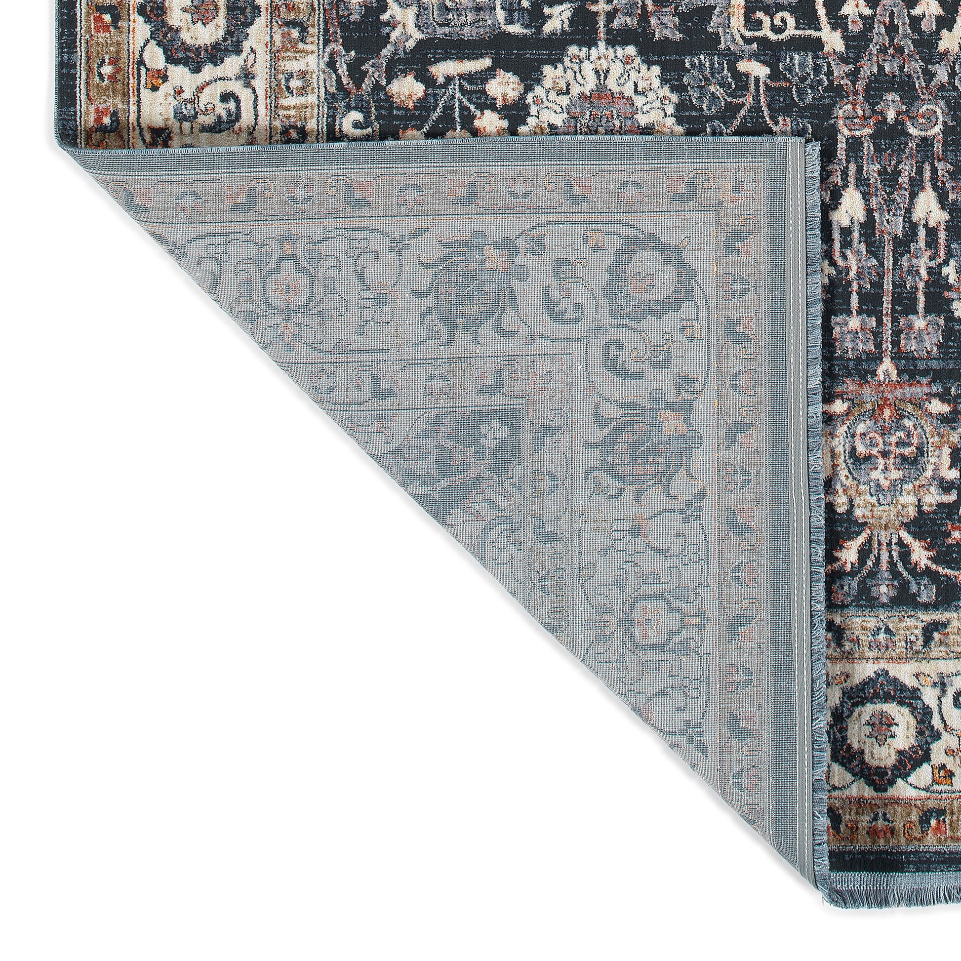 Persianstyle area rug in dark blue with distressed floral pattern and fringe detail