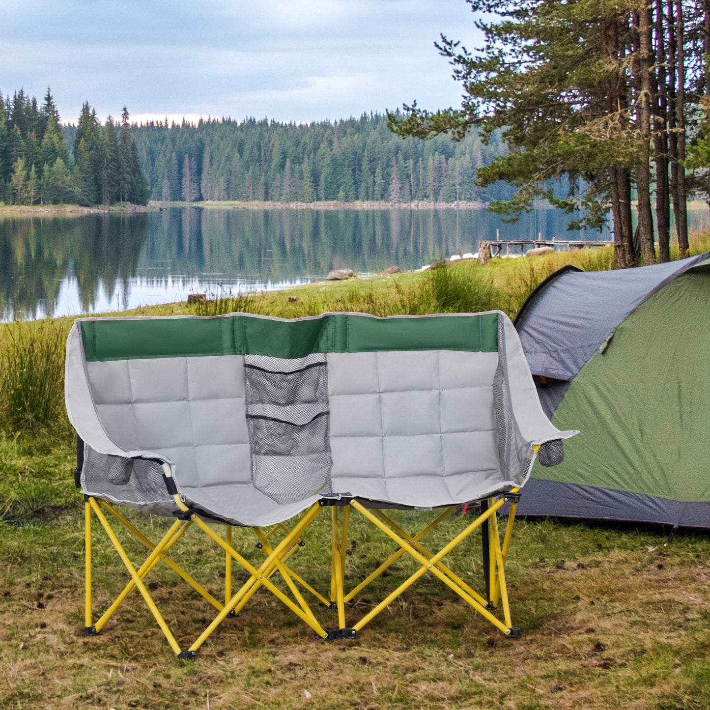 Padded grey and green camping loveseat with yellow frame and mesh pockets