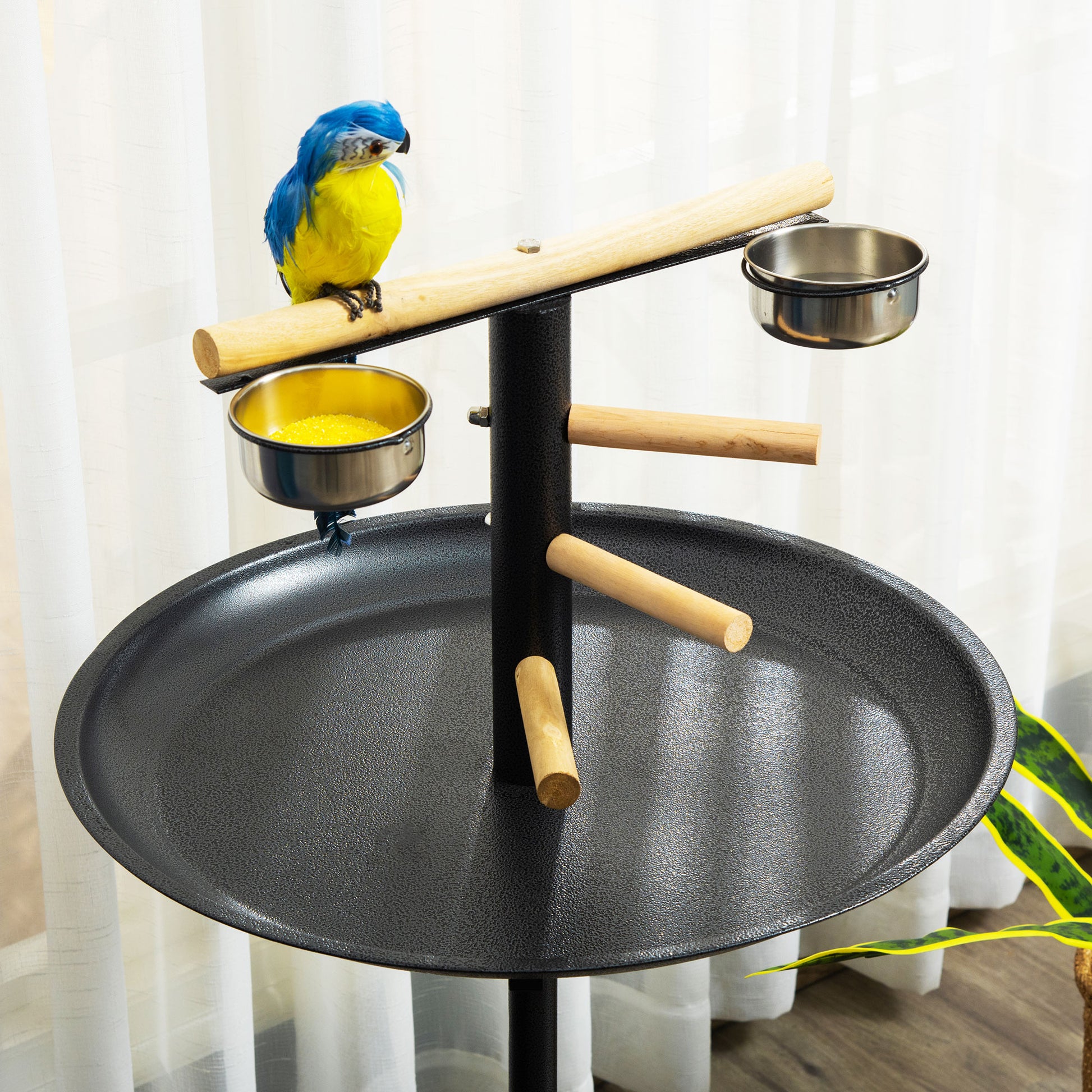 Adjustable bird perch with seed tray and metal bowls perfect for parrot training
