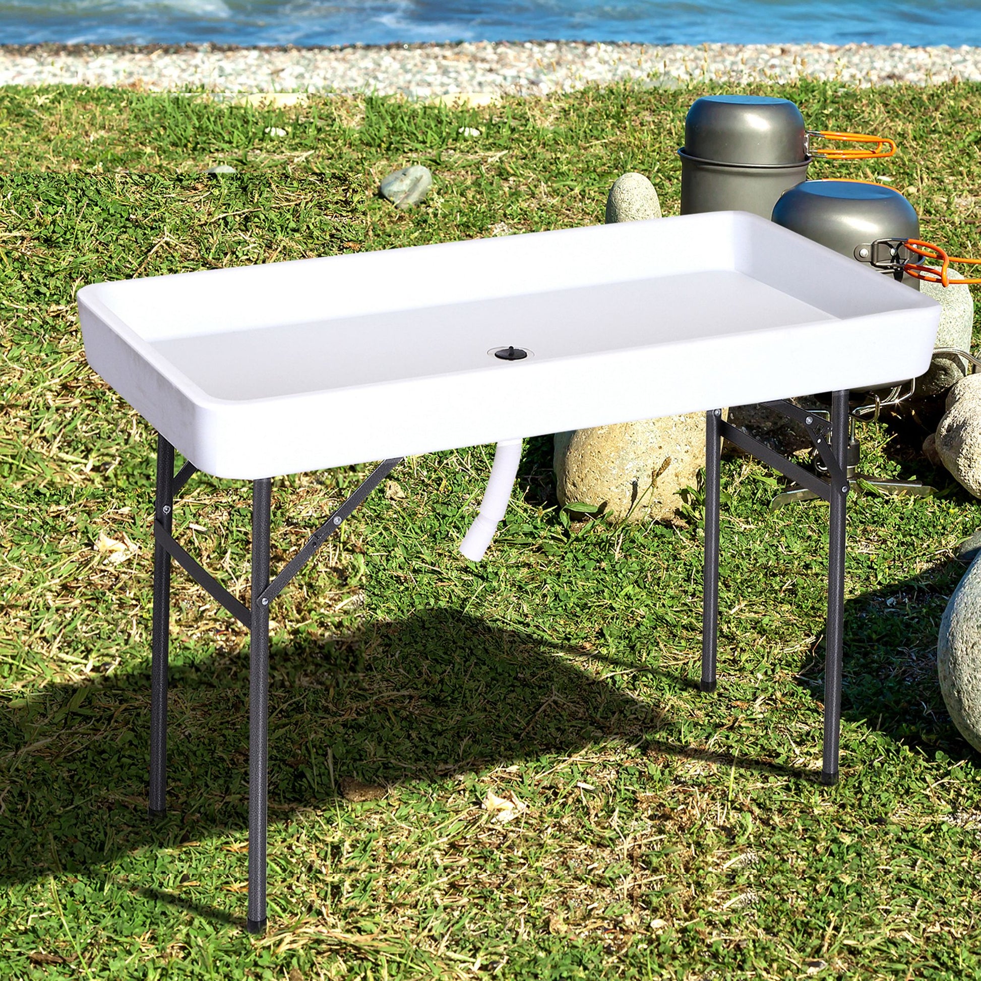White portable fish cleaning table with drain hose and folding legs for outdoor use