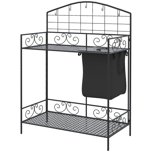 Black wrought iron potting bench with decorative scrollwork and integrated hanging bag