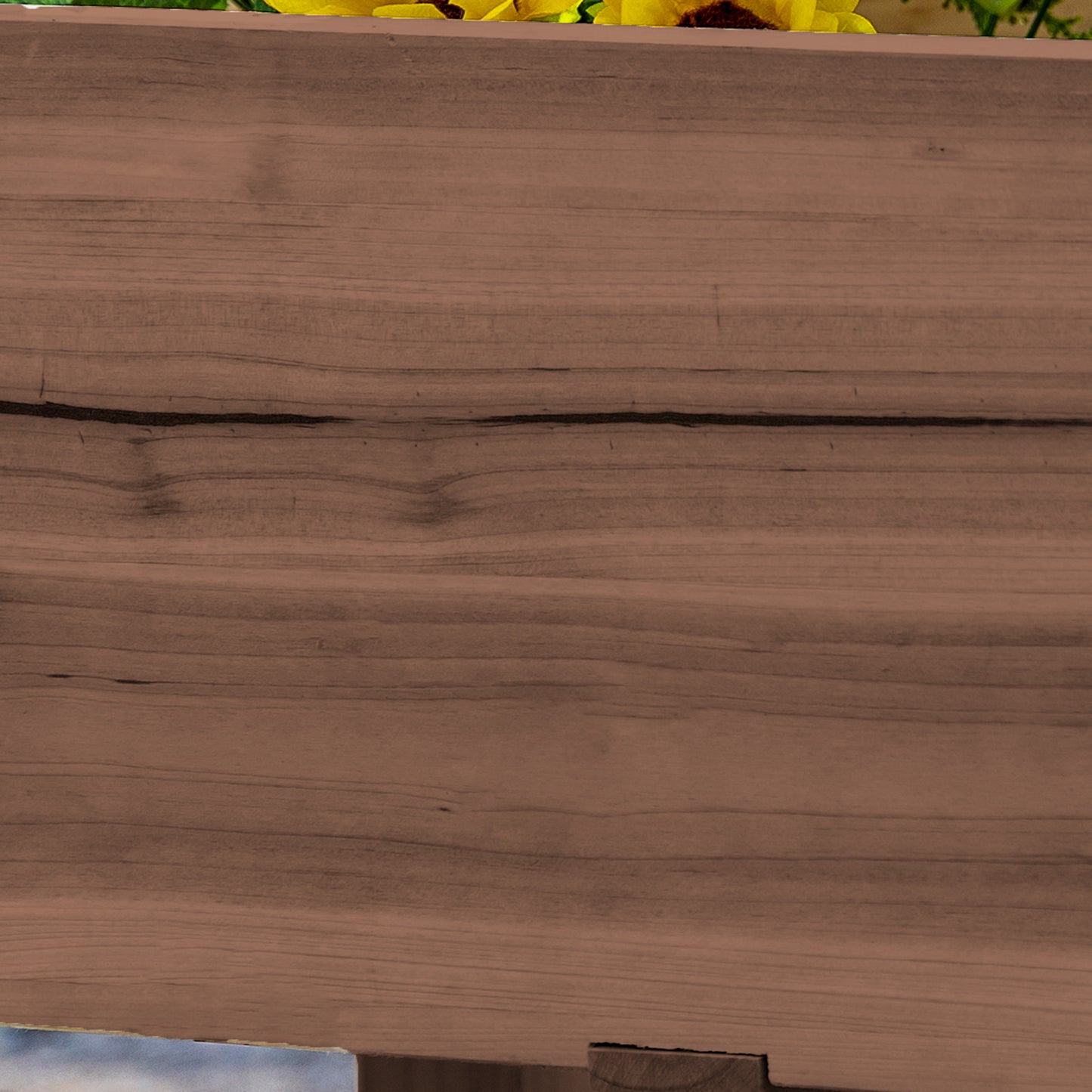 Rustic wooden planter box with vibrant yellow sunflowers spilling over the edge