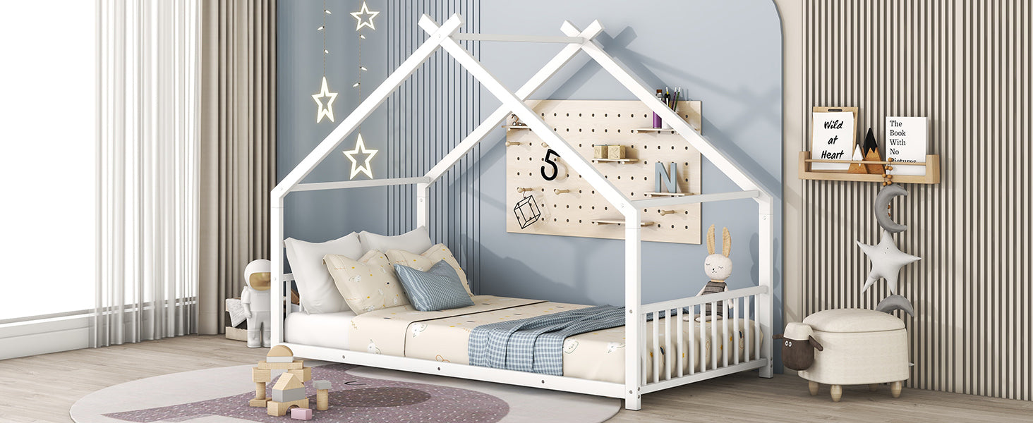 White wooden house bed frame for kids with playful bedding and star decor