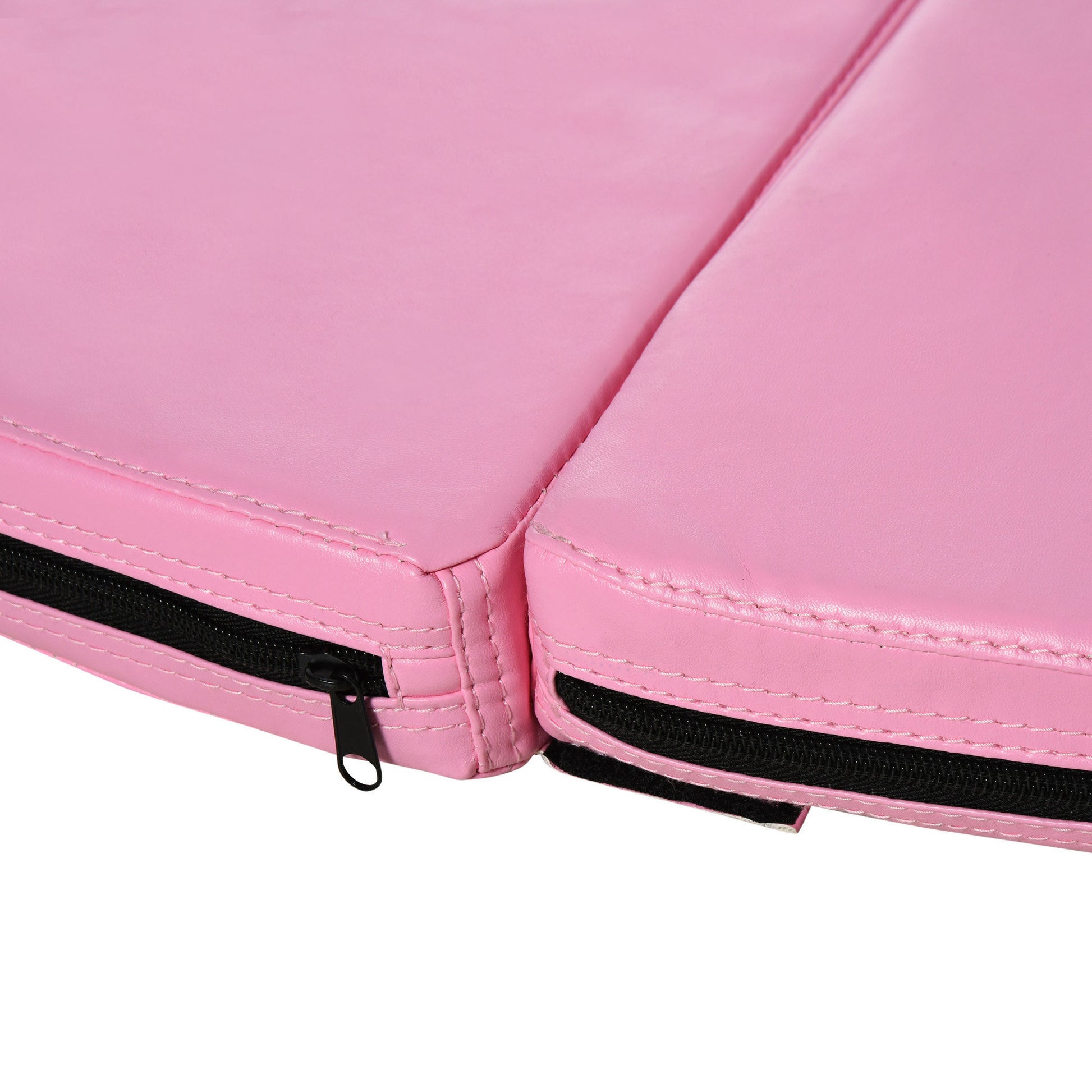Closeup of pink gymnastics mat with black zipper detail