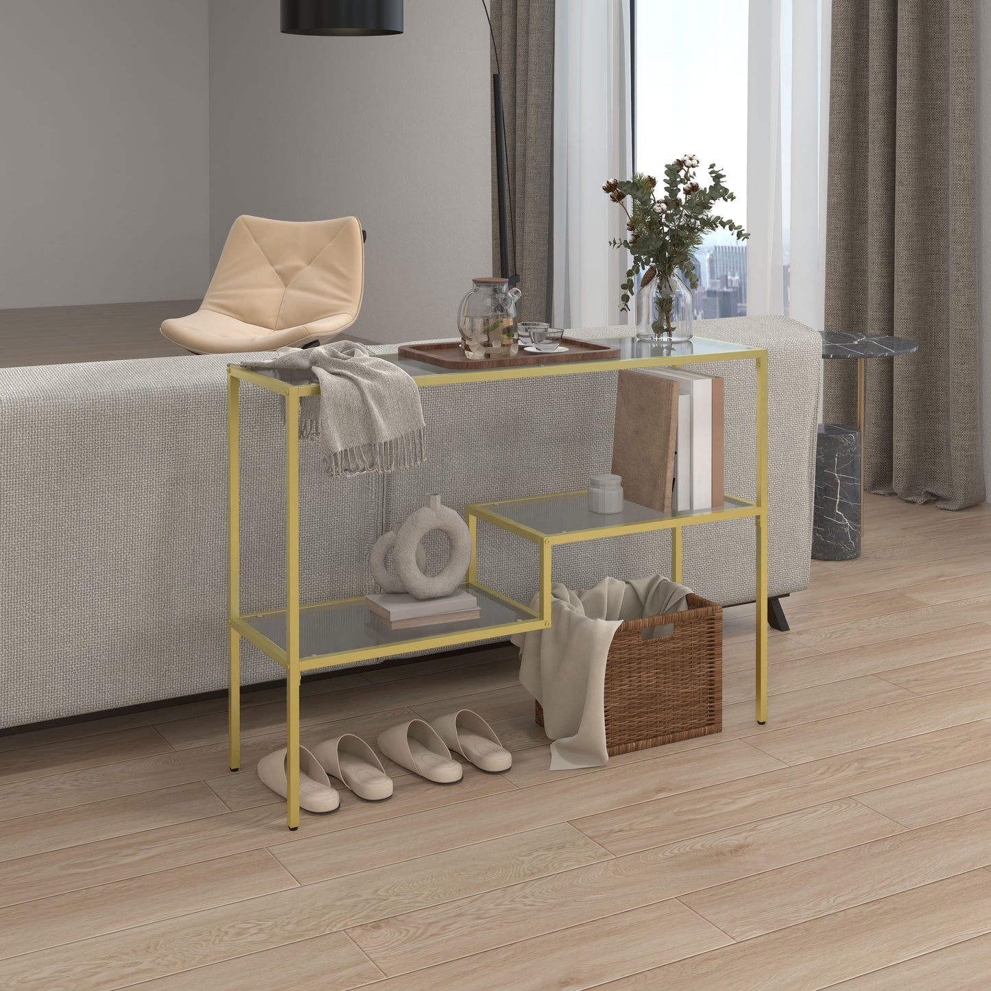 Slim gold accent table with glass shelves and decorative items