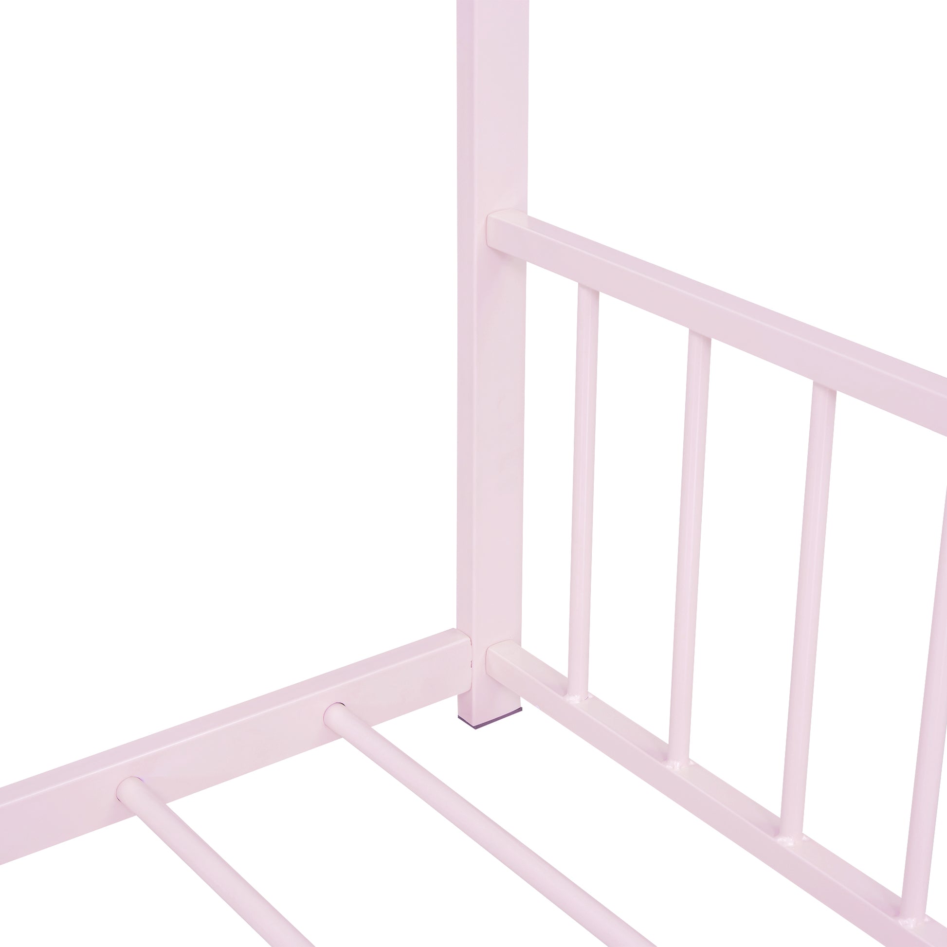 Pale pink metal twin bed frame with slatted base