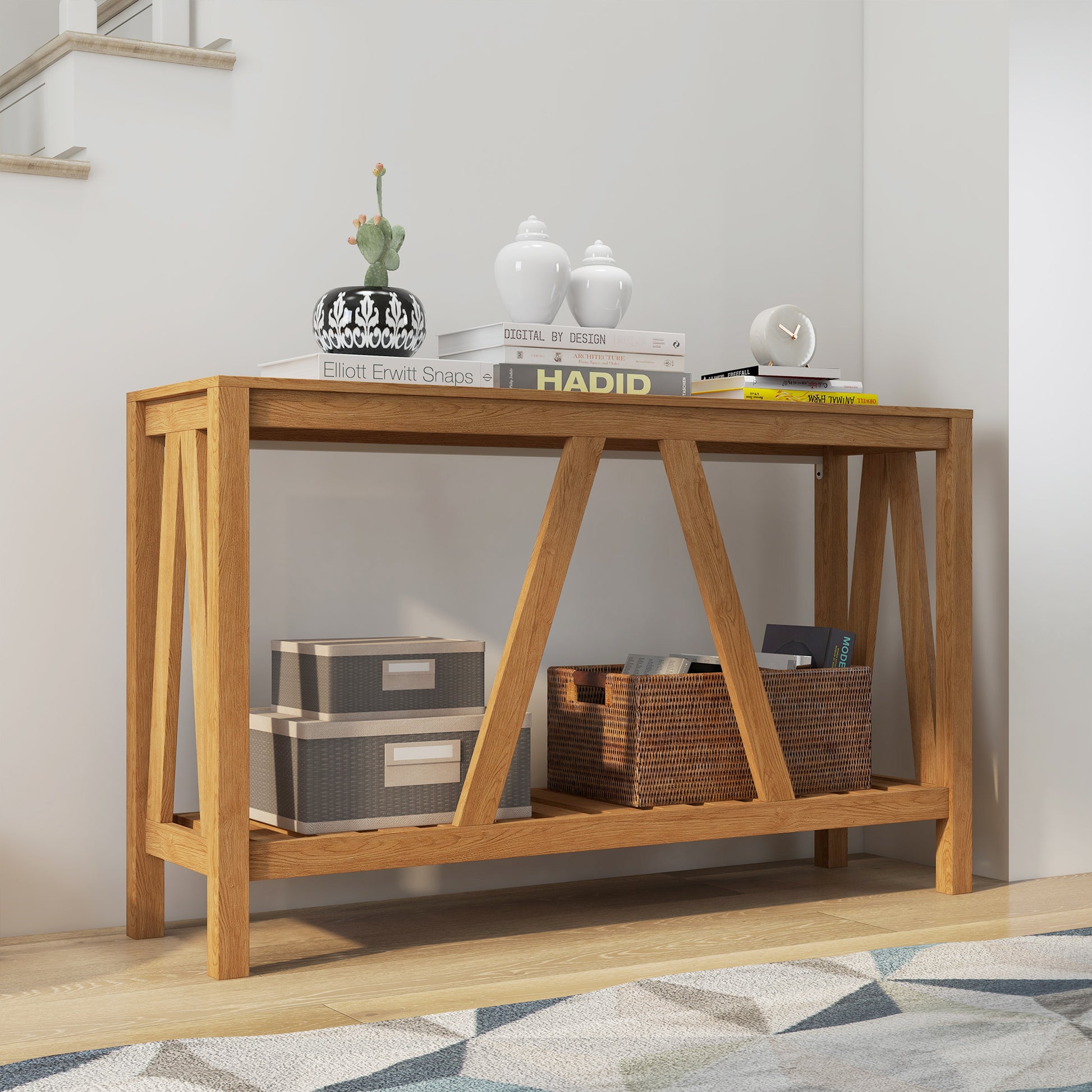 Solid wood entryway table with geometric leg design and decorative items