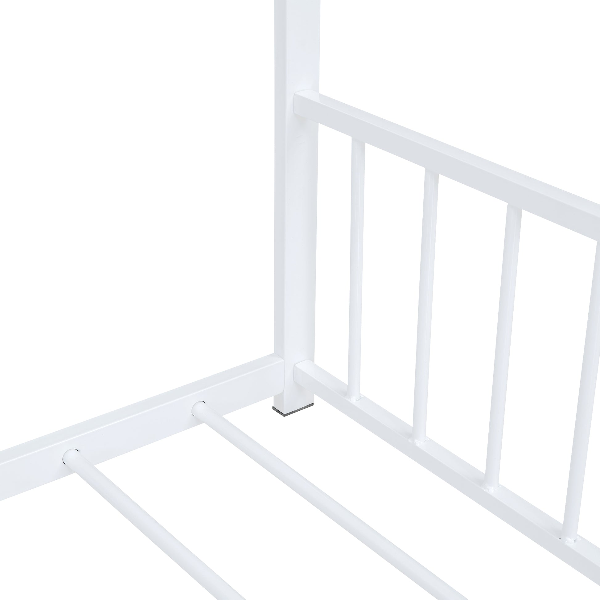 White metal bed frame corner detail with slatted base and railing