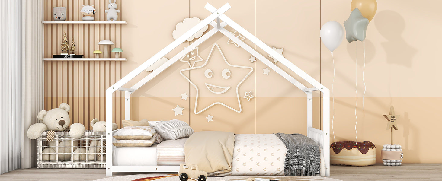 White wooden kids house bed with a star motif and neutral bedding