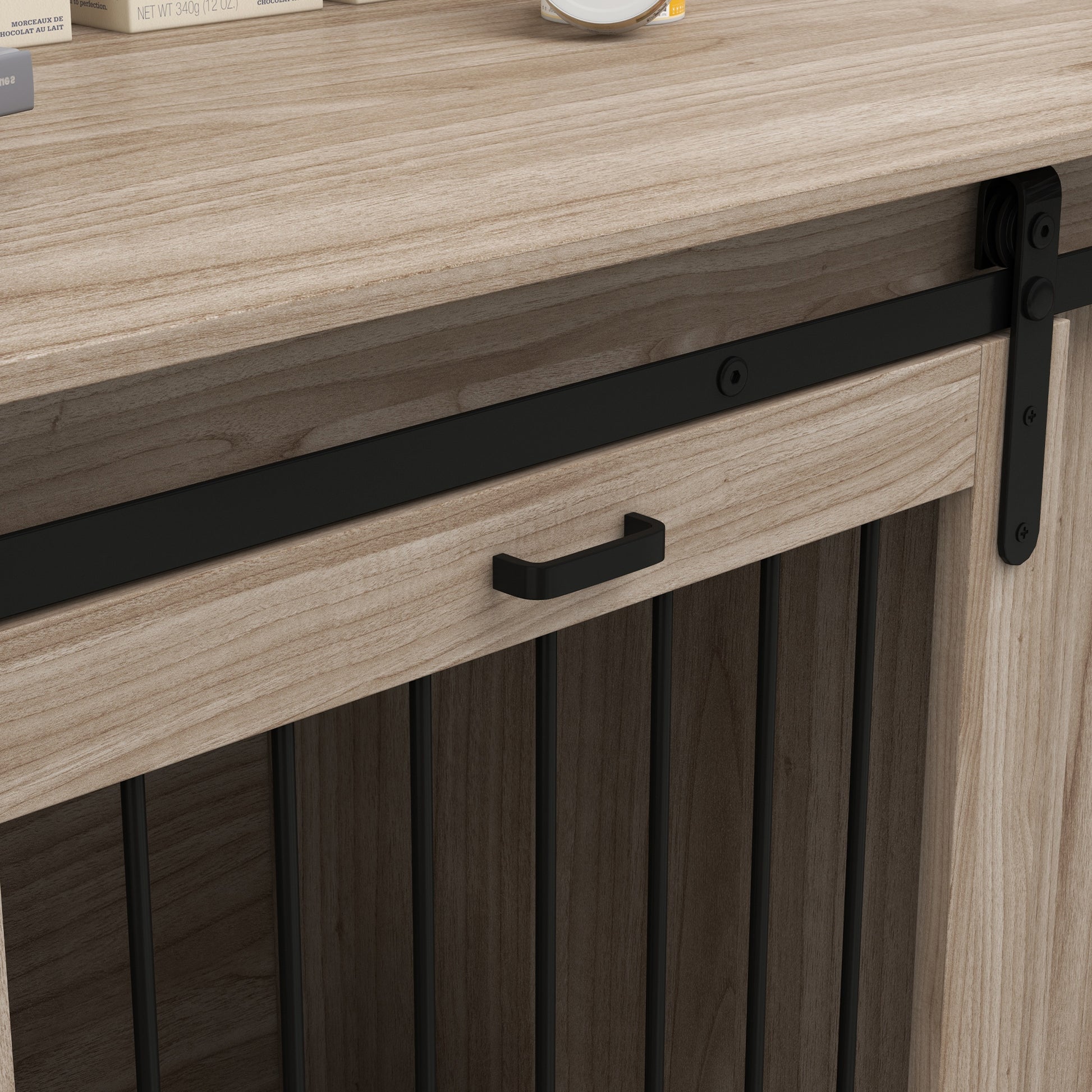 Light oak wood furniture with black metal sliding barn door hardware and handle