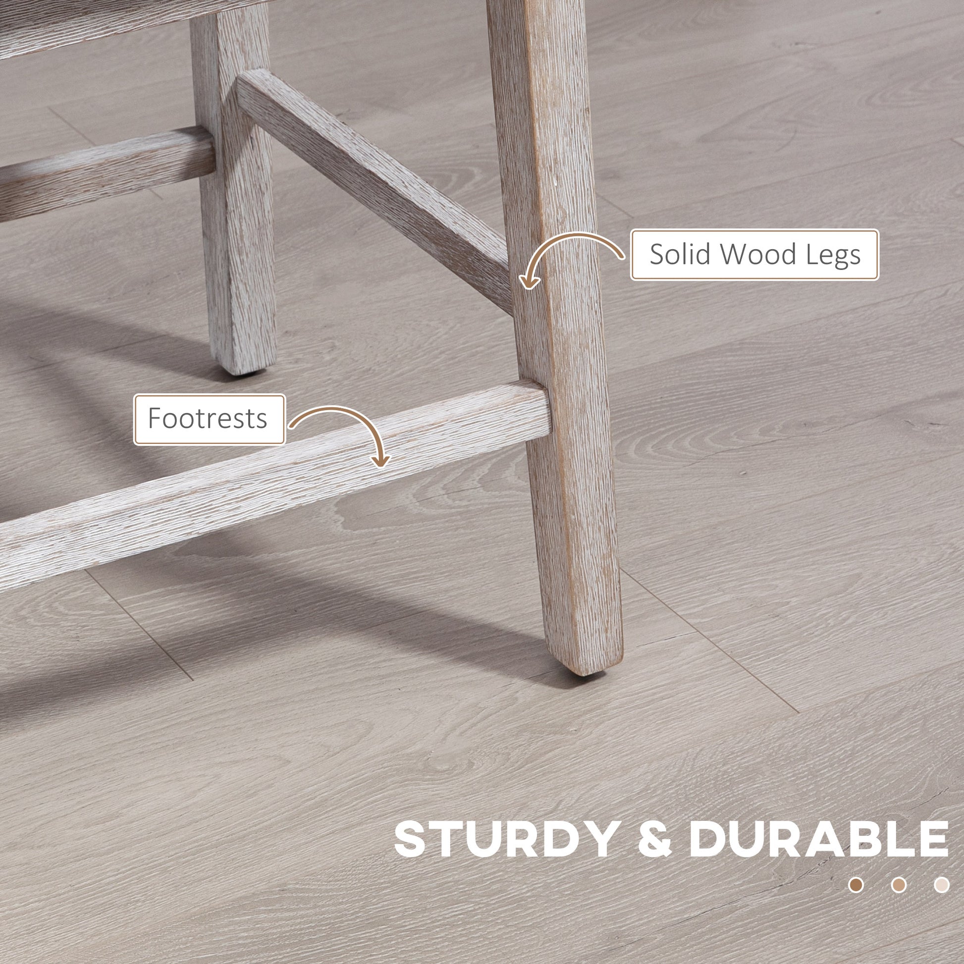 Closeup of a rustic whitewashed wood bar stool leg with footrests for comfort