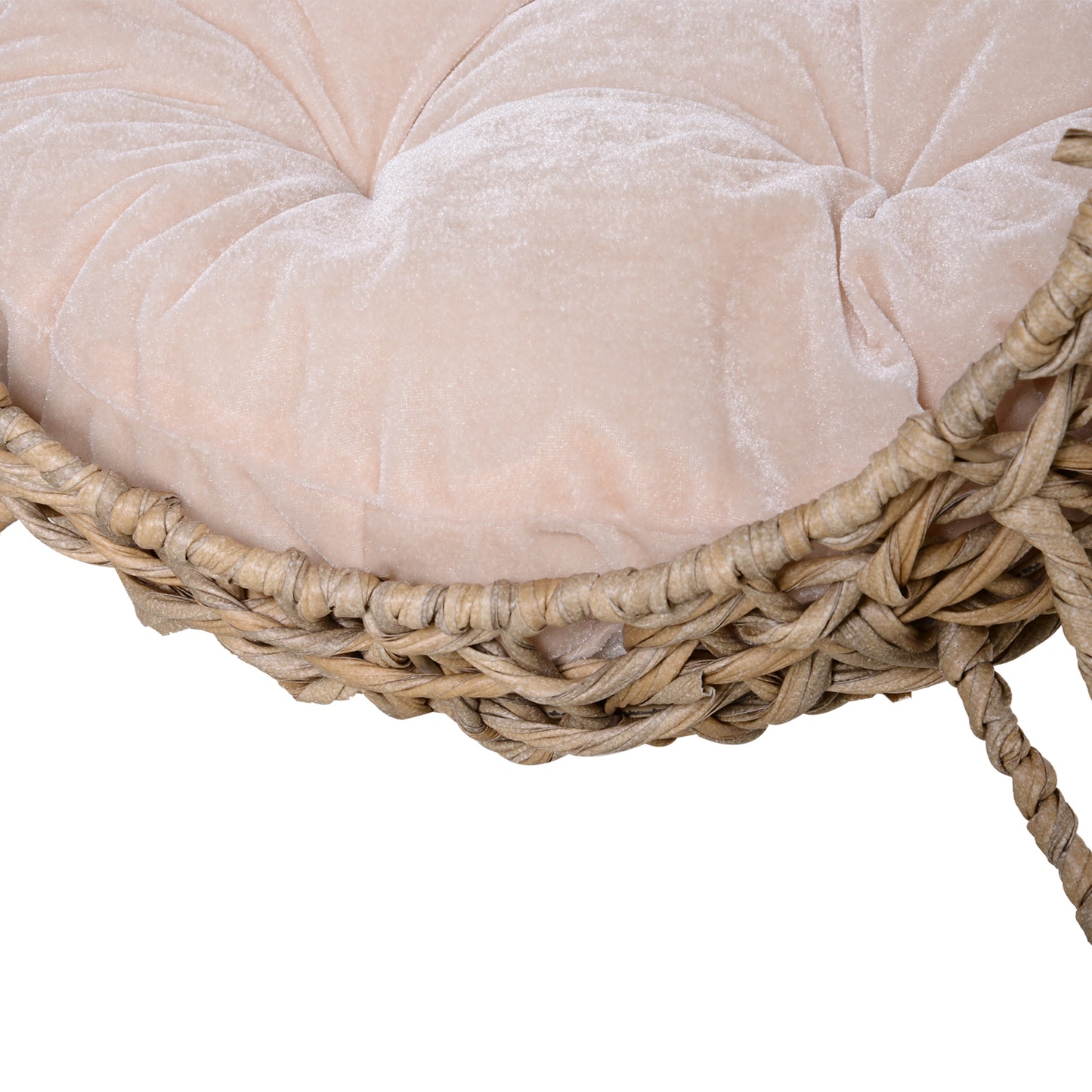 Close up of plush tufted blush pink velvet cushion on a woven wicker accent stool