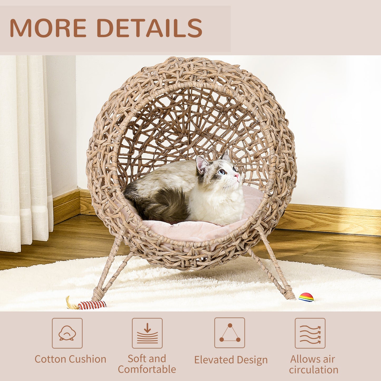 Round rattan cat bed with pink cushion and cat inside