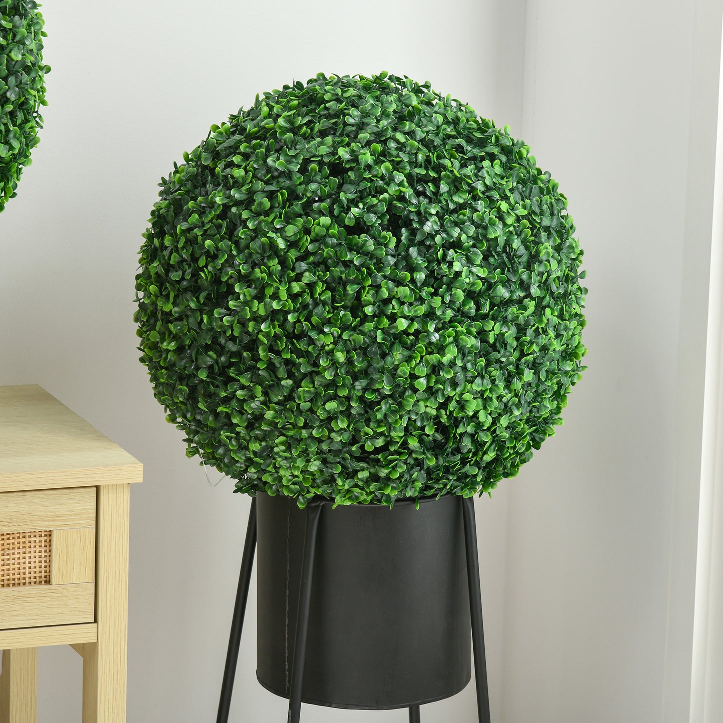 Large artificial topiary ball in a black planter perfect for home decor