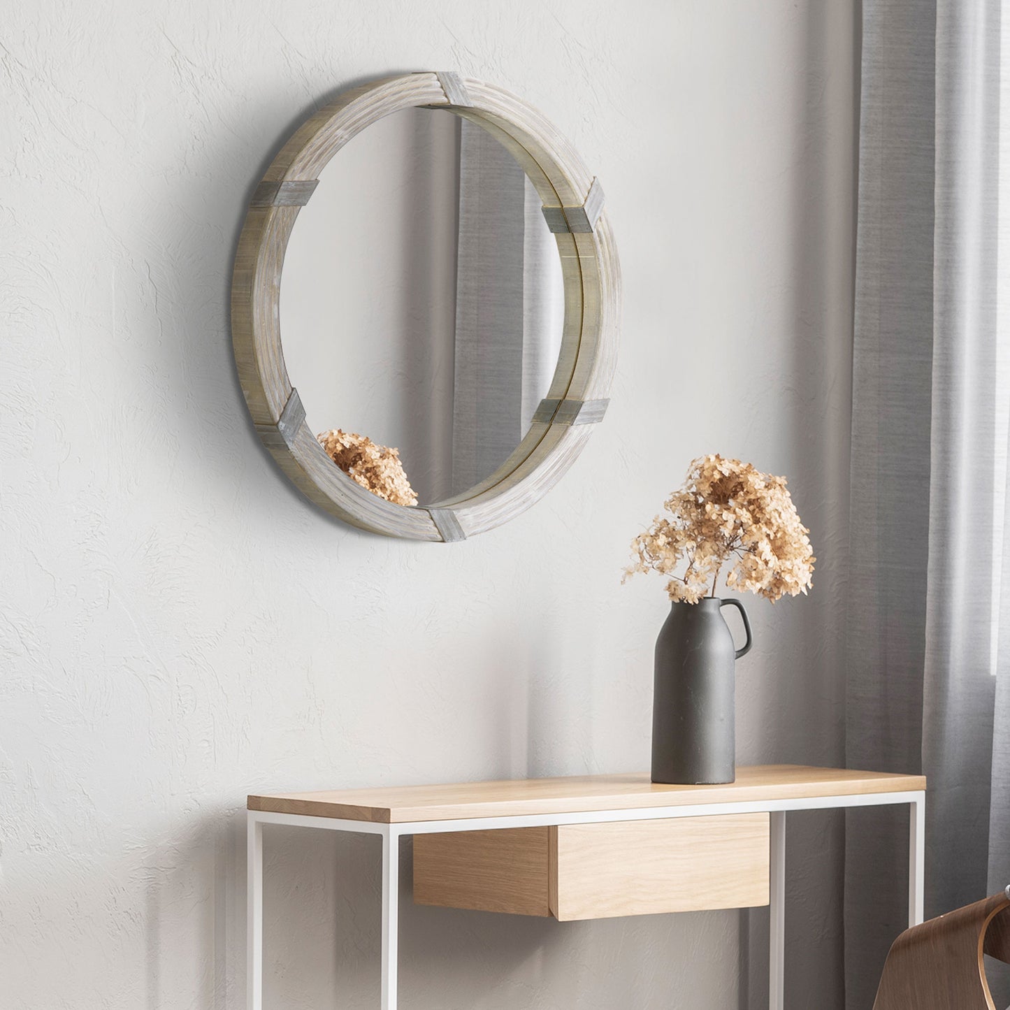Round wall mirror with rustic grey wood frame and metal accents