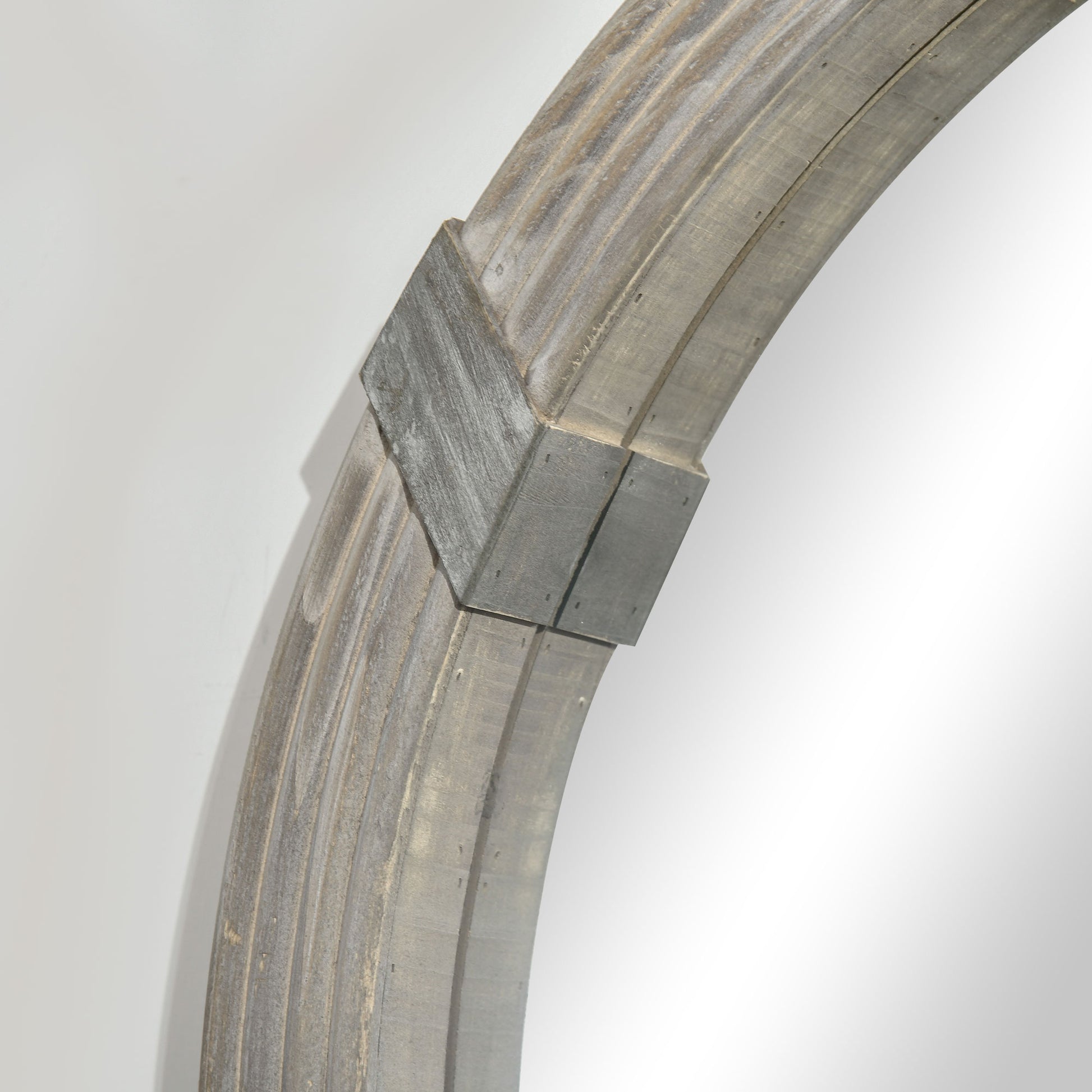 Arched distressed wood frame with metal accents suitable for entryway decor