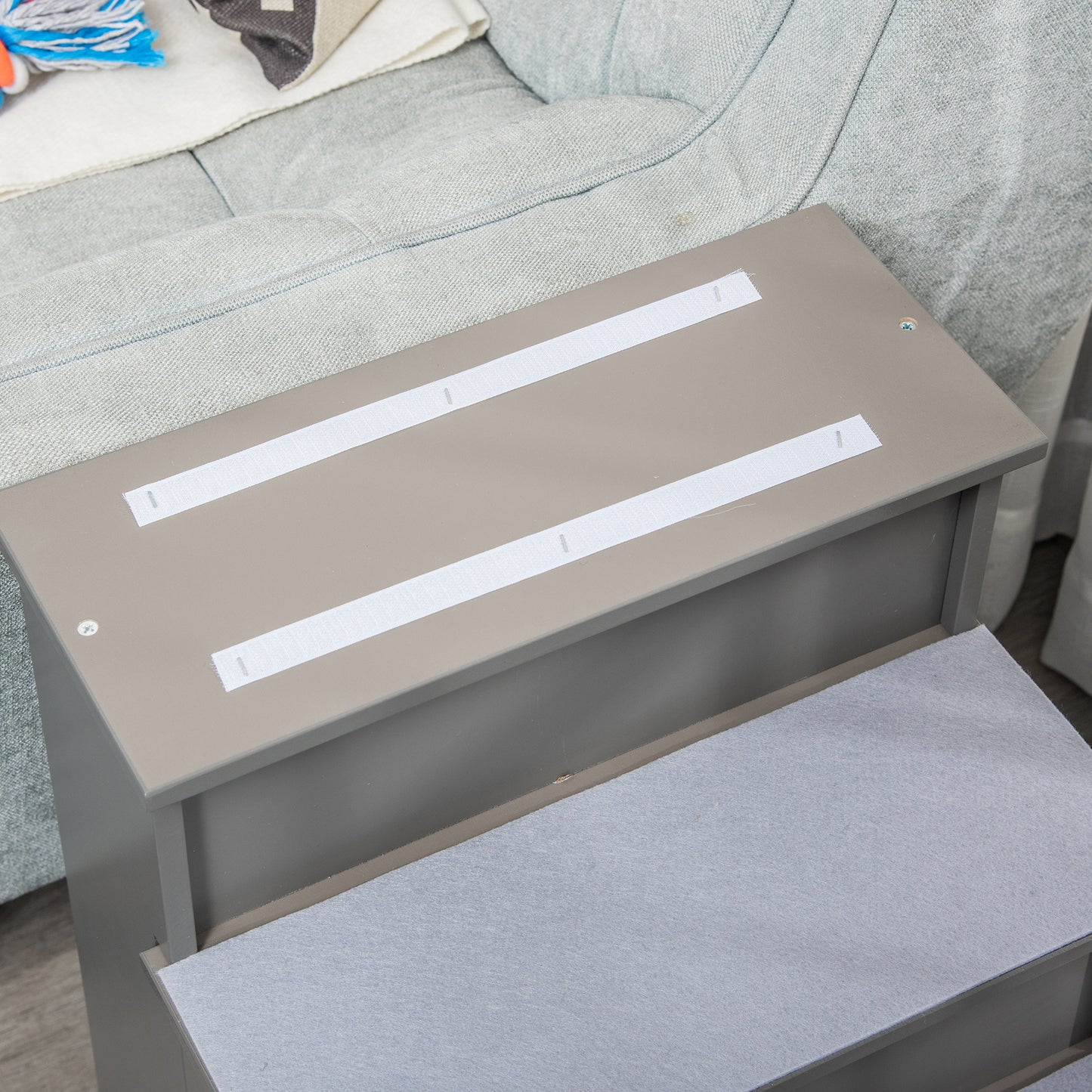 Taupe pet stairs with nonslip grey carpet treads and velcro strips on top