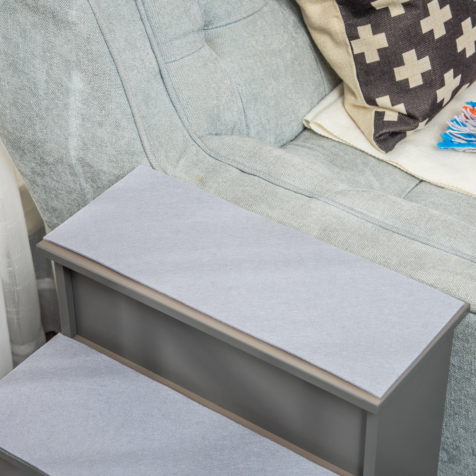Grey fabric pet stairs with two steps for easy access to furniture