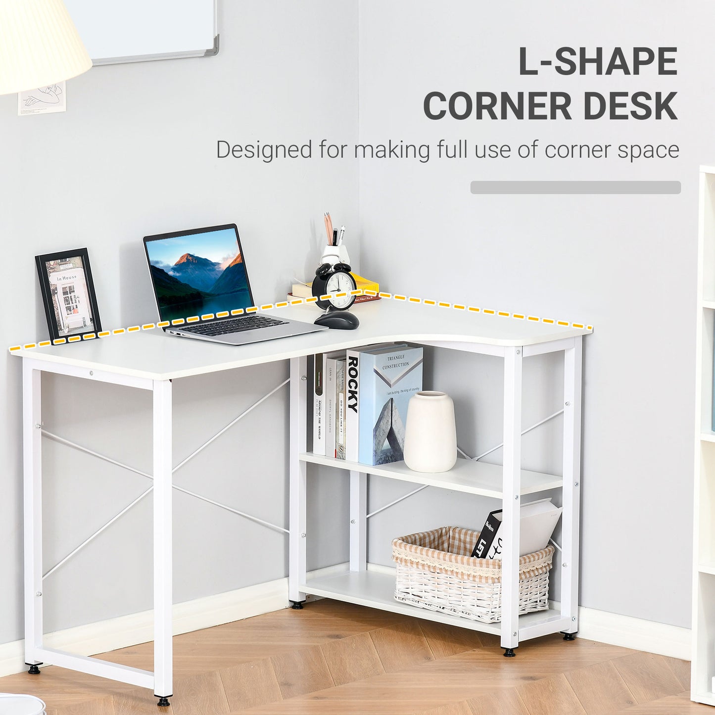 White lshape corner desk with a laptop framed picture and alarm clock on top