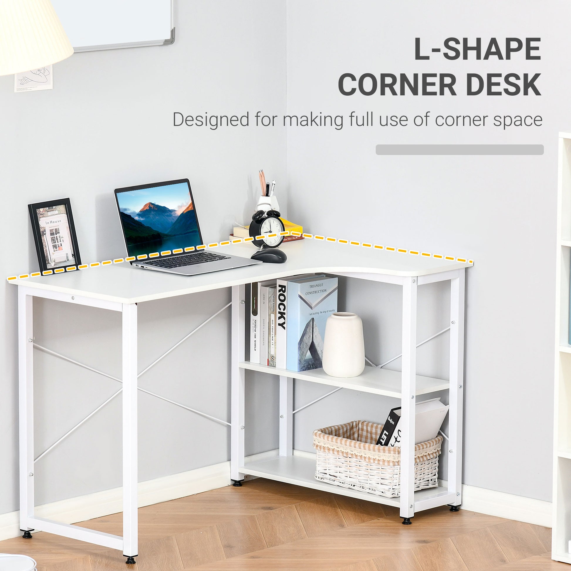 White lshape corner desk with a laptop framed picture and alarm clock on top