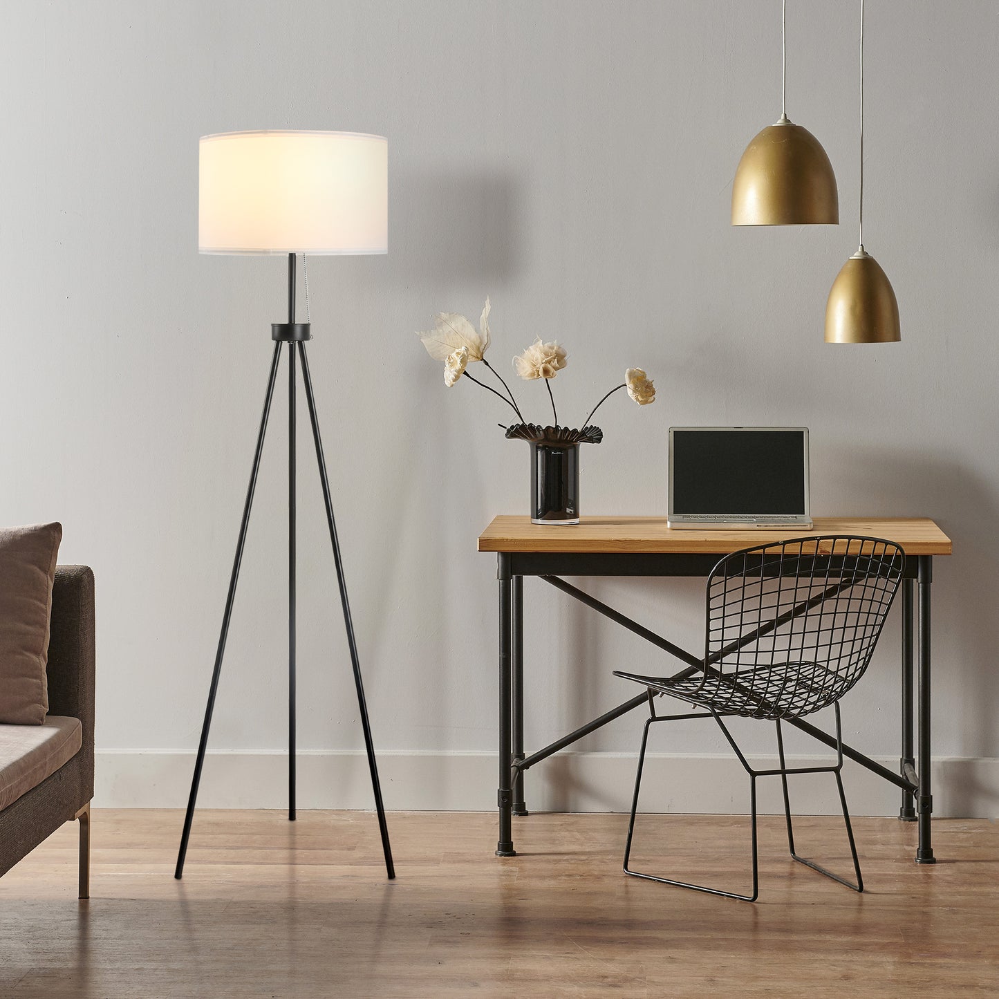 Black metal tripod floor lamp with white drum shade ideal for modern living rooms