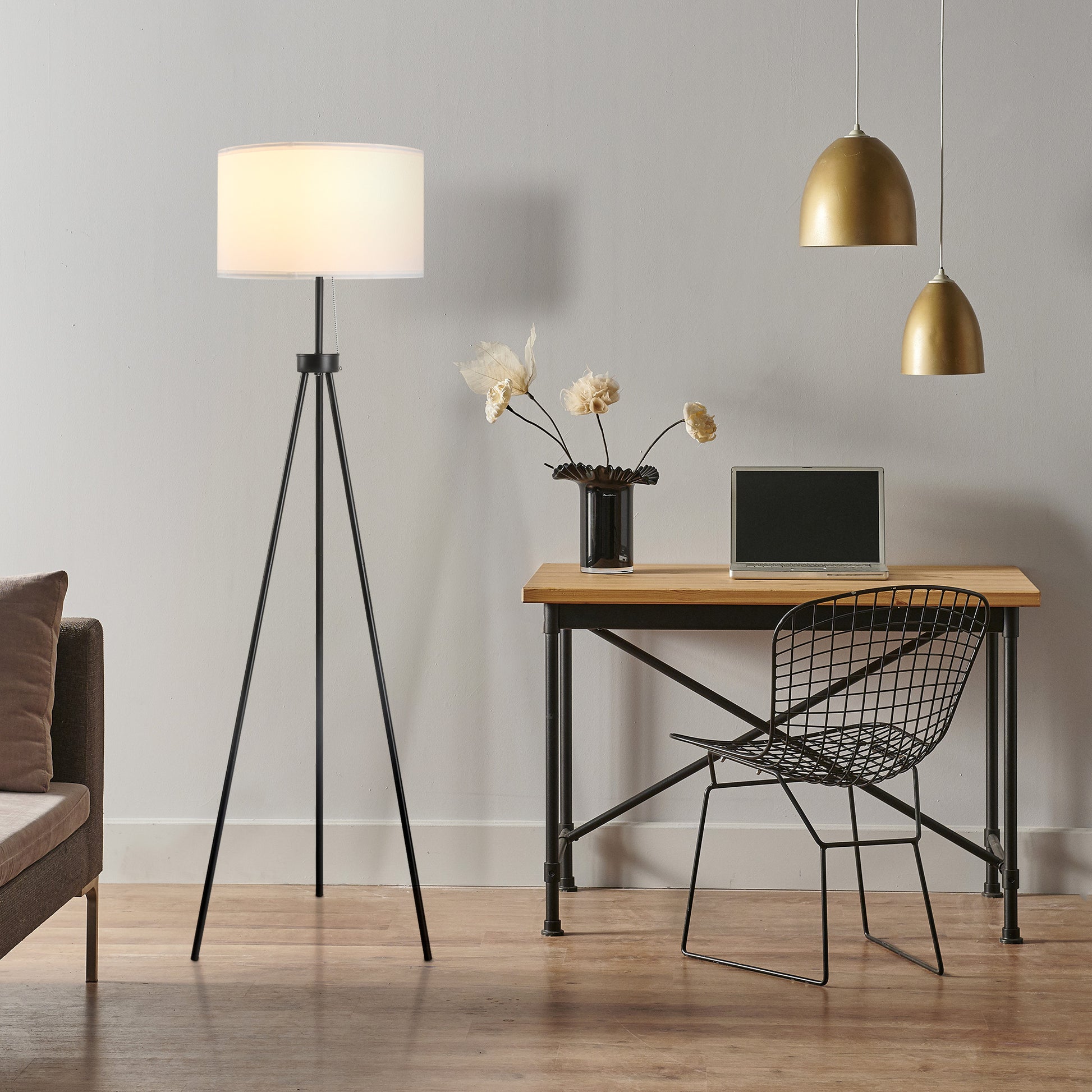 Black metal tripod floor lamp with white drum shade ideal for modern living rooms