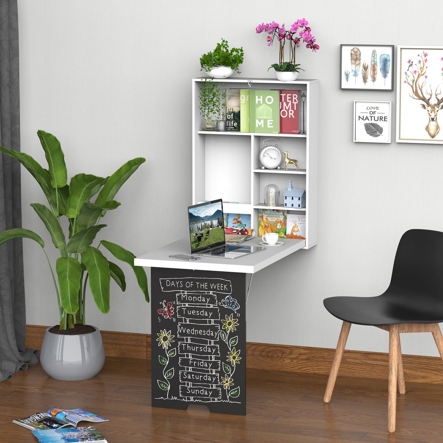 White wallmounted folding desk with shelves featuring a laptop and decor