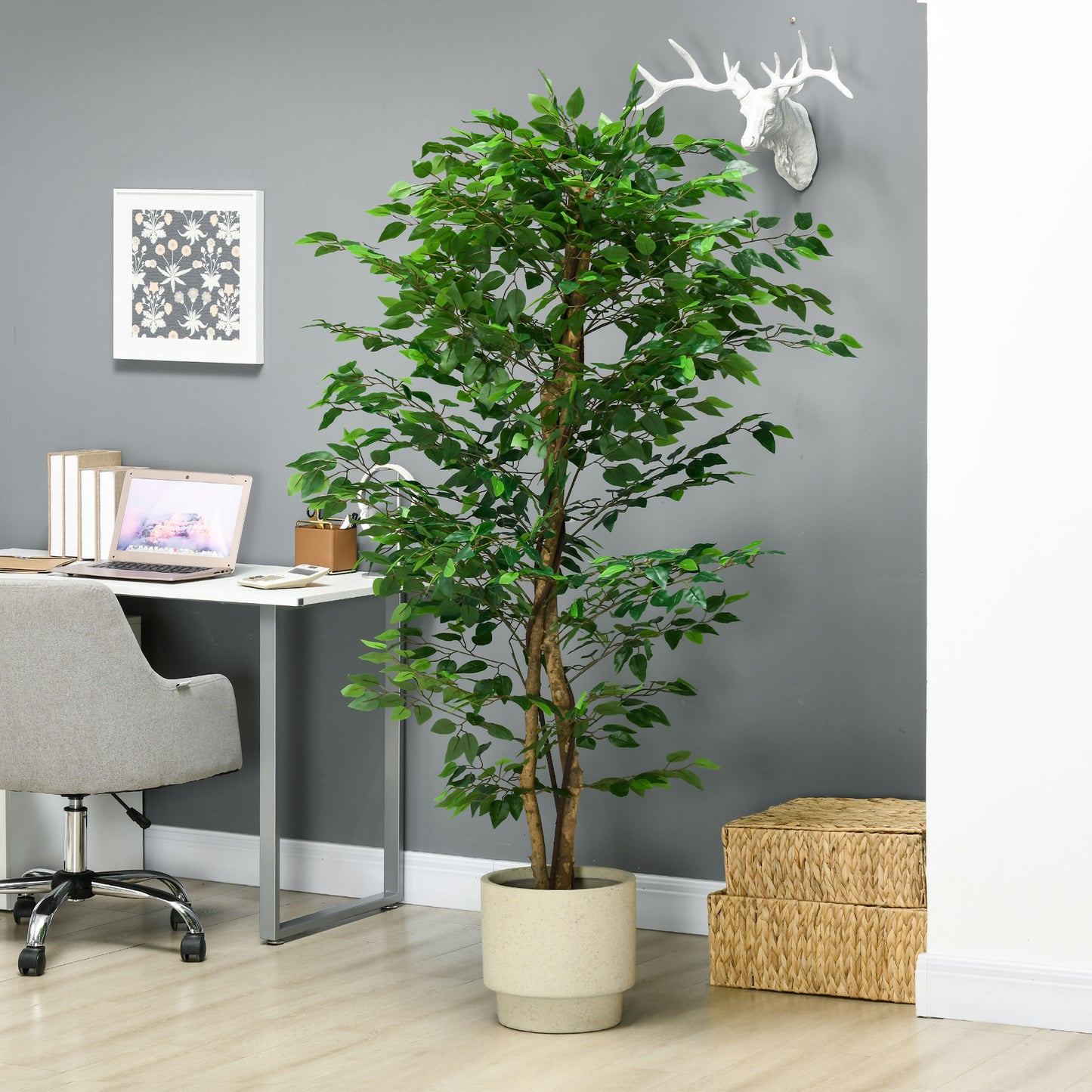 Tall artificial ficus tree with realistic green leaves and a beige pot perfect for home decor