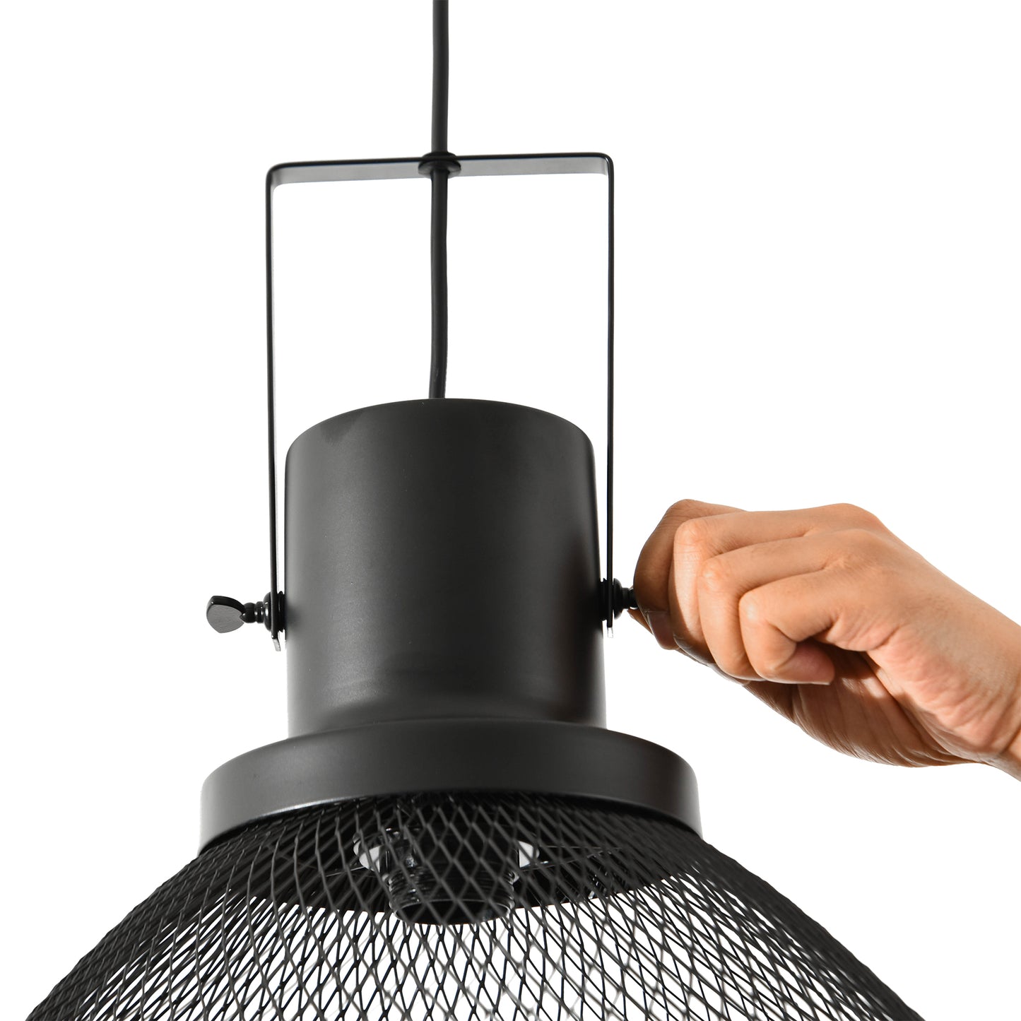 Closeup of a hand adjusting a black industrial pendant light with a mesh shade
