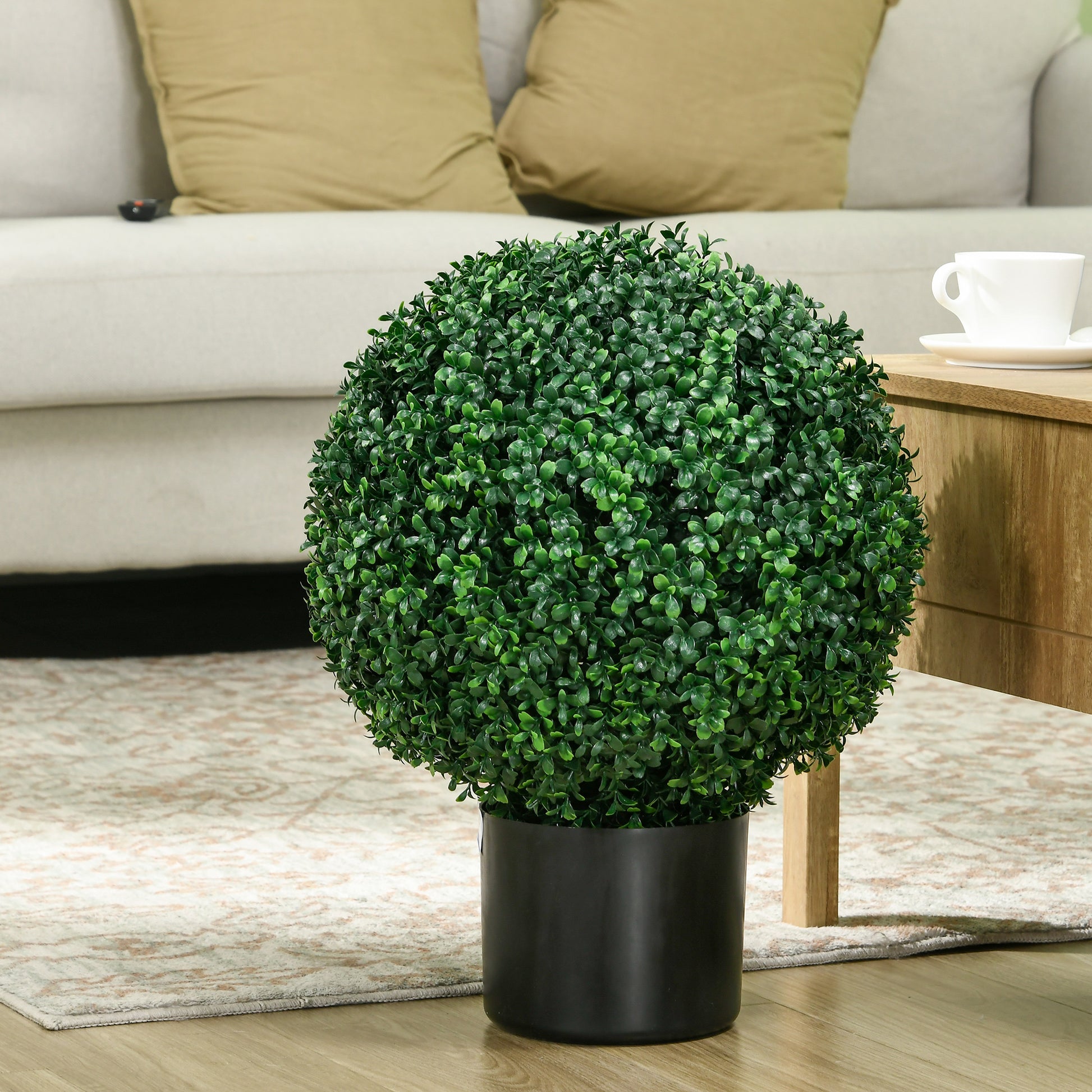 Realistic green boxwood topiary ball plant in a black pot perfect for indoor decor